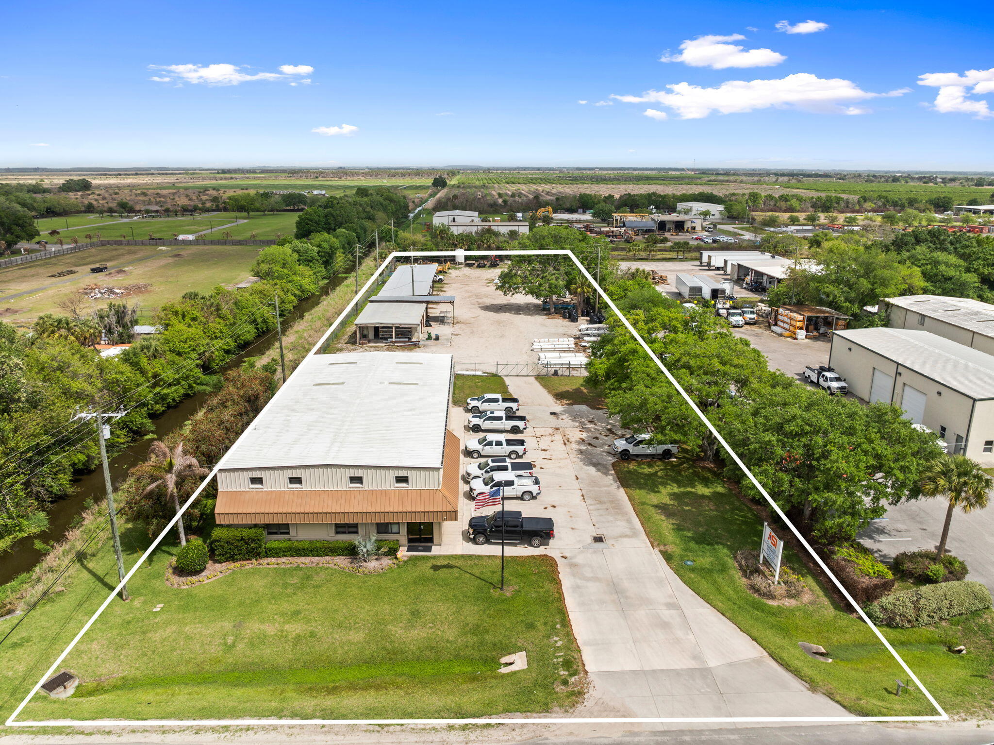Introducing an exceptional investment opportunity in Fort Pierce, FL - a fully equipped industrial property located at 16050 Orange Ave. Spanning 1.98 acres of prime light industrial zoning, this property features a 14,224 SF building with 2,741 SF of Office Space and 2,626 sf of Warehouse space plus an additional 3,354 sf of Shop Area. Boasting a comprehensive suite of amenities including fully fenced and secured premises, covered parking for up to 10 vehicles, and a convenient parts counter, this property offers unmatched potential for industrial and manufacturing ventures. With a rich history dating back to 1986 and a subsequent renovation in 2021, this well-maintained facility is an ideal fit for forward-thinking investors.