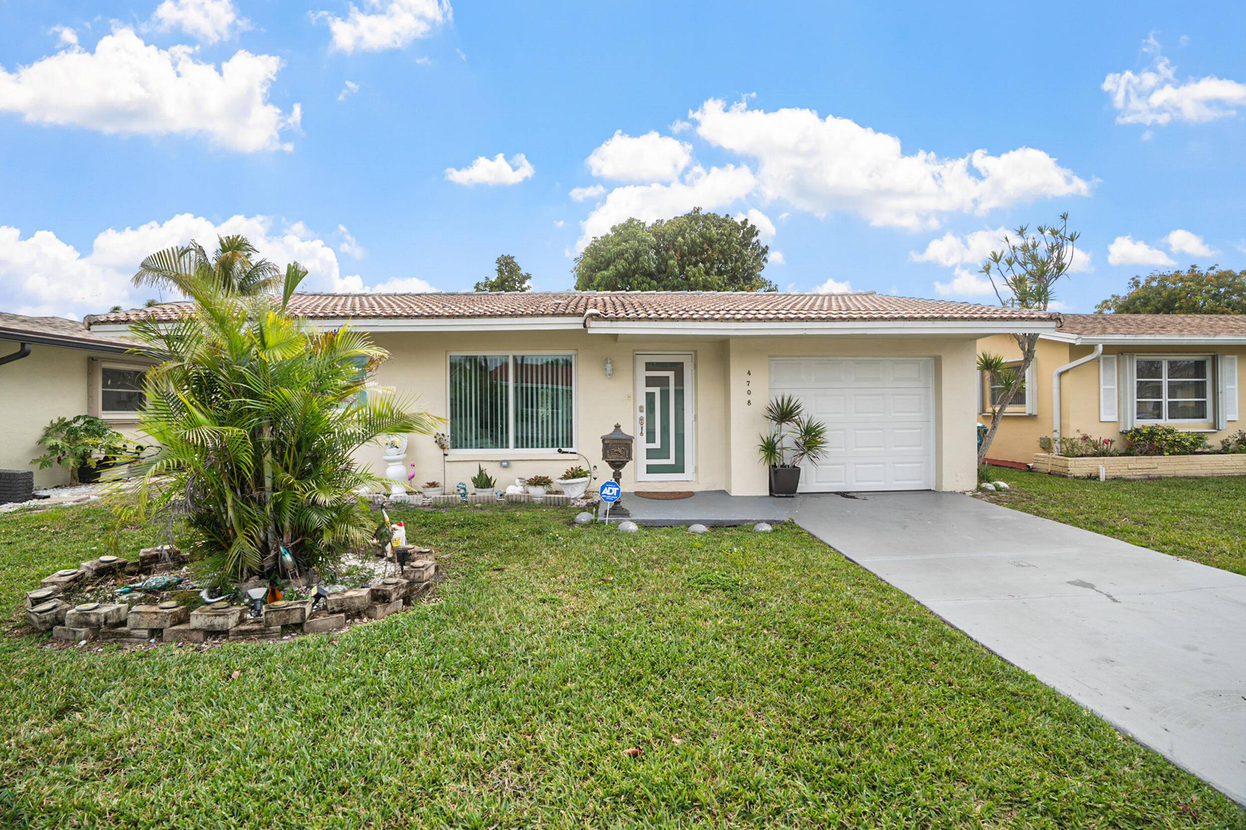 Beautiful semi-remodeled 2-bedroom, 1-bath home featuring elegant porcelain tile flooring throughout and a one-car garage. Ideally located in a prime location within a desirable 55+ community, just one block from the Turnpike entrance and minutes from US-441 for easy access to shopping, dining, and everyday conveniences. Enjoy a vibrant active adult lifestyle with access to a resort-style clubhouse and community amenities. Conveniently located within a short drive to the beautiful beaches of Fort Lauderdale Beach. A wonderful opportunity for comfortable and convenient South Florida living!