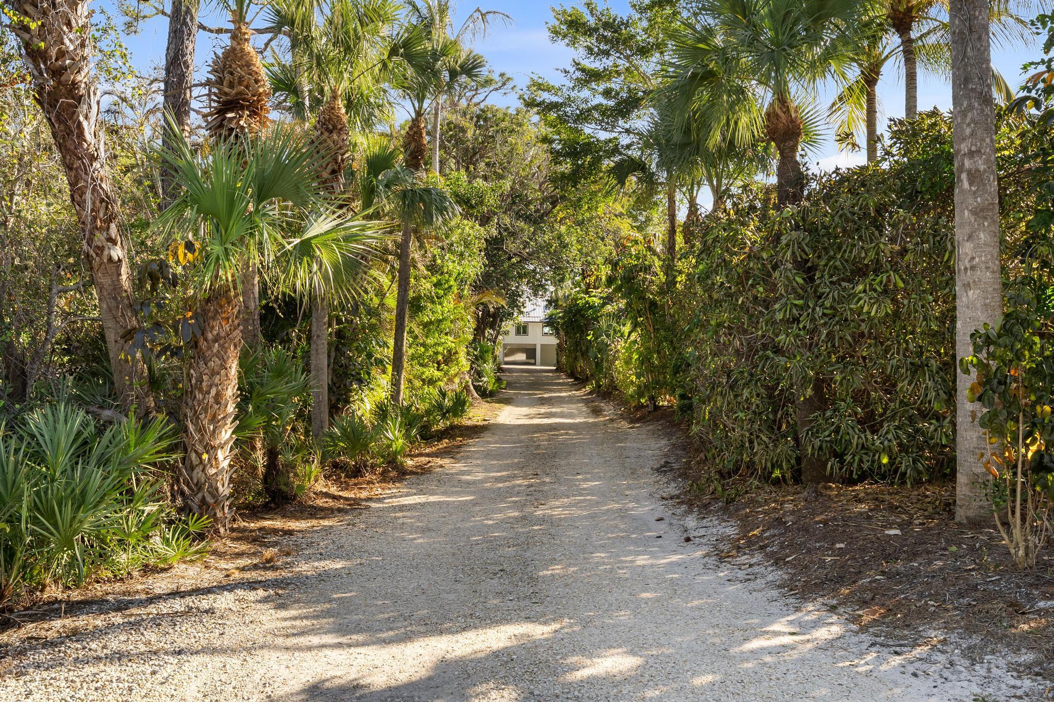 Available for Annual Rental!  Located at the end of a palm lined private drive, the home underwent a meticulous renovation, concluding in 2023. This luxurious Florida Keys-inspired retreat, combining high-end finishes with full functionality. Enter the main upstairs living via an oversized contemporary door & you are welcomed with panoramic, wide water views.  The main living area offers immense living & entertaining possibilities, with multiple sitting areas, Thermador appliances & gas range. Main suite is an escape, with oversized shower.  Second guest room can function as another primary suite, with oversize en suite bath.  Laundry features pet wash. Outdoors come alive from the upstairs gazebo and expansive deck area, with wide water and downtown views. Downstairs guest cottage has private entrance features bathroom and kitchen, perfect for family, friends, or tenants.  For true water enthusiasts, enjoy two boat lifts (16k and 10k capacity). Immense storage for those needing to keep equipment safe & sound.
