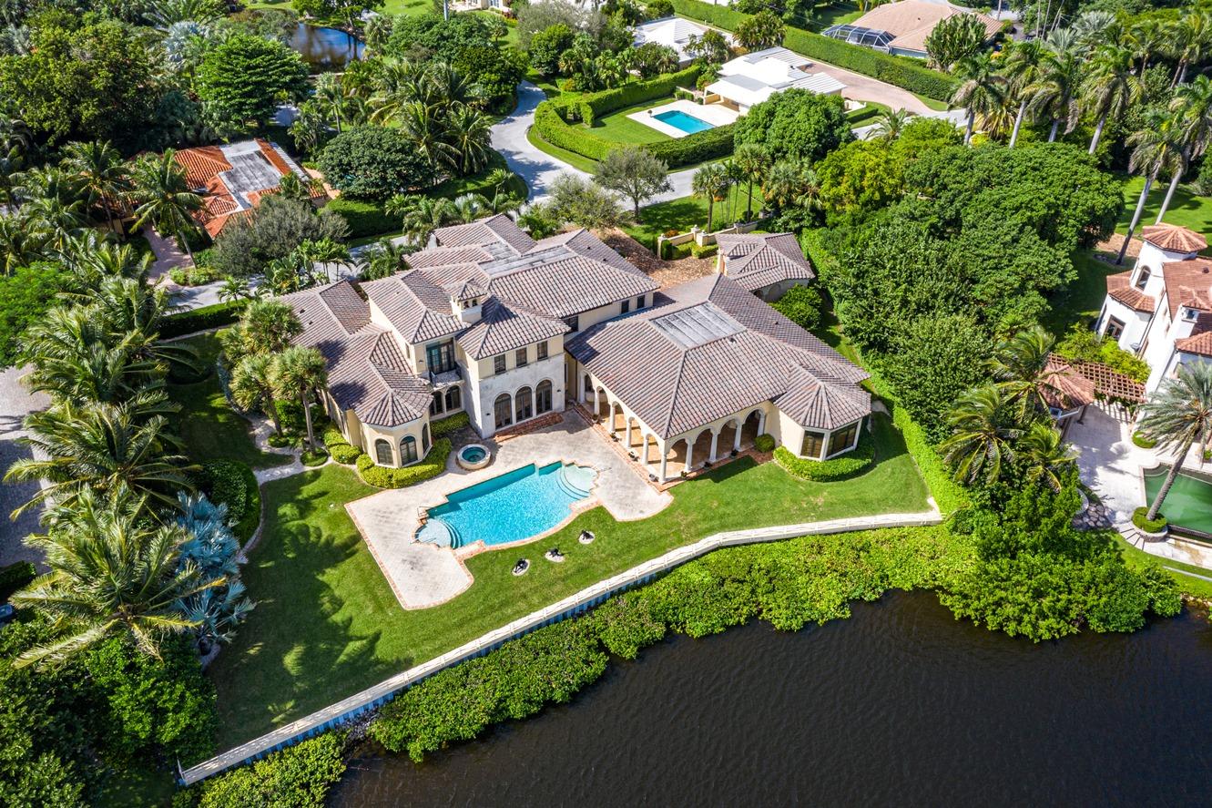 Enjoy Privacy & Upscale Waterfront Living on Beautiful Point Manalapan!
This gorgeous Mediterranean-style home, built by renowned Wadsworth Builders, offers over 8,100 SF of living space with 5 bedrooms and 5.5 bath located on .74 acres of waterfront property on Point Manalapan, a beautiful, secure south Florida island community. Enter the Chicago Brick circular drive and walk through the columned and arched entryway through the custom, solid wood arched front door and into the gorgeous marble floored foyer that leads to the home's open floor plan. You'll be impressed by the beautiful spiral staircase with custom wrought iron railings, the sheer spaciousness of the room with its soaring two-story high coffered ceiling with custom design and artistic details. The soft curving archways that lead into every room are accented by the strength of the marble and stone columns, and breathtaking is the only word you can use to describe the incredible fireplace and the magnificent views of the pool and Island waterway. The entire lower level is bathed in the soft natural light that flows throughout the home's many hurricane glass protected windows and doors. 
 
Formal entertaining is easy in the large living room with an adjacent wet bar that also serves the exquisite formal dining room with its high coffered, artistically accented ceiling and massive, columned and arched entryway.  For more casual entertaining there's the magnificent, large den/family room with custom coffered box ceiling and a billiard room immediately adjacent, all with fabulous water views. 
 
For personal space the home provides a beautiful office that is separated from the main body of the house offering both privacy and spectacular views of the water. 
 
The gourmet kitchen with nearby informal dining area features a stainless steel Sub Zero refrigerator and freezer, dual ovens, a hooded Thermador gas range with custom tile backsplash, both a prep area with sink, a full stainless steel sink and expansive counter space with custom wood cabinetry. 
 
The master bedroom suite on the main level provides a large sitting area with beautiful views of the water.  There are large walk-in closets and a spacious bathroom with dual sinks, a large walk-in glass enclosed shower and a tub with spa accented by beautiful Roman columns and offering a lovely, secluded garden view.
 
The upper level is accessible by the beautiful stairway or for added ease and convenience you may choose to use the built-in elevator. The upper floor features access to the outer balcony area, a charming inside sitting area, a large comfortable den with great views of the water as well as access to the other large bedrooms, all with lovely views and beautiful bathrooms. 
 
You'll love the gorgeous sunsets with the southwestern view of the skies from your beautiful outdoor patio that overlooks the yard, pool and waterway.  For backyard entertaining there's a covered patio area with a lovely tongue-in-groove wood ceiling, an outdoor kitchen area with hooded grill and you're just steps away from the nearby in-ground heated pool and separate spa, all surrounded by a cool-deck walkway. The beautiful yard features mature palm trees and landscaping, and a concrete walkway with railing along the 169 feet of water frontage with a new seawall.
 
Some of the many additional features of this home include a 4-car garage, state-of-the-art security and alarm system, and a whole house generator.
 
Included with owning a fabulous home in one of south Florida's most prestigious areas, Manalapan home ownership and residency comes with a gratis membership to the La Coquille Club, a cherished part of the Manalapan experience. Members are granted access to the club's many amenities, including pool, spa, private beach, tennis, golf, a business center, fitness and club room. Members are not charged initiation or fees and are billed only for the goods and services enjoyed while at the club.
 
Additional advantages to living in Manalapan are the town's police force, the nearby library and the lowest property tax base in Palm Beach County. All of this is within a few minutes' drive of some of south Florida's best upscale shopping and dining.