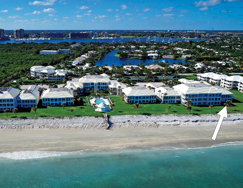 Spectacular ocean views!! Direct oceanfront condominium with three bedrooms and four bathrooms in Lost Tree Village. With more than 3,000 square feet of living space, this first floor, corner unit is located in Greathouse. Featuring an abundance of light throughout and ocean views from almost every room. Perfectly situated with direct beach access and steps to the Lost Tree Beach Club.