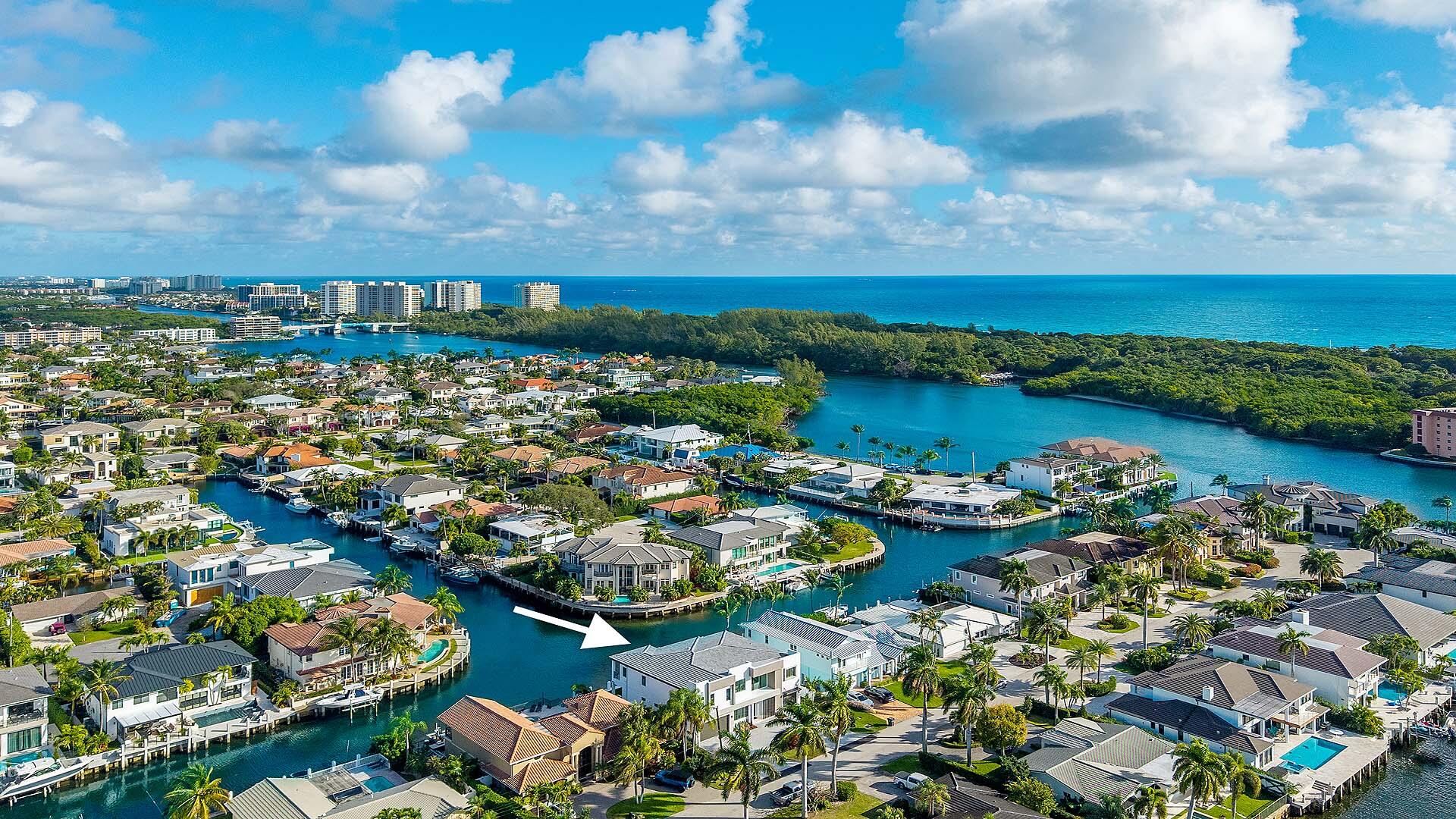 Crafted by Charles Thomas Builders, this brand new waterfront residence is a rare offering in Blue Inlet, one of East Boca Raton's most coveted enclaves. Moments from the beach, Intracoastal and ocean access, Mizner Park, and Atlantic Avenue in downtown Delray Beach. Set on 80' of waterfrontage with long water views and a wide canal for easy boat maneuvering. Features include a 3 car garage, custom kitchen with Thermador appliances and wet bar, floor to ceiling glass sliders, covered loggia with summer kitchen, ground floor VIP guest suite and office. Upstairs, the primary wing enjoys a waterfront balcony, dual walk in closets, and custom bath, accompanied by 3 additional guest suites, loft and laundry room. Boasting poured concrete construction on pilings, this home is ready for season! Crafted by Charles Thomas Builders, this brand new waterfront residence presents a rare offering in Blue Inlet, one of East Boca Raton's most coveted coastal enclaves. Ideally positioned just moments from the beach and the Boca Inlet, with direct Intracoastal access just seconds from the private dock, and a short drive to Mizner Park and Atlantic Avenue in downtown Delray Beach, the location delivers the very best of South Florida coastal living.  Set along 80 feet of prime waterfront frontage, the home enjoys extraordinary long water views and a uniquely wide canal that allows easy boat maneuvering and turnaround. Designed for refined living and entertaining, the residence features a three car garage, a custom chef's kitchen with a premium Thermador appliance suite, and floor to ceiling glass sliders that frame the water from nearly every main living space. A covered loggia with summer kitchen creates a seamless connection between indoor elegance and outdoor leisure.  The ground floor offers a private VIP guest suite and a dedicated office. Upstairs, the expansive primary wing captures captivating water views, a private waterfront balcony, dual walk in closets, and a spa inspired bath. Three additional guest suites and a loft complete the upper level. A custom residential elevator connects both floors with ease and convenience.  Built with poured concrete construction and set on pilings, this residence reflects exceptional craftsmanship, structural integrity, and enduring quality. Brand new, thoughtfully executed, and perfectly positioned on the water, this is a rare opportunity to own a truly exceptional coastal estate ready to be enjoyed immediately.  All images and visual materials associated with this property, including AI generated images, virtually staged photos, edited images, artist conceptual renderings, maps, site plans, floor plans, and other graphics, are provided solely for illustrative purposes. These representations may not accurately reflect current conditions and are subject to change without notice. No representations or warranties are made regarding the accuracy or completeness of these visual materials. Buyers should not rely solely on these materials and are responsible for independently verifying all property details.