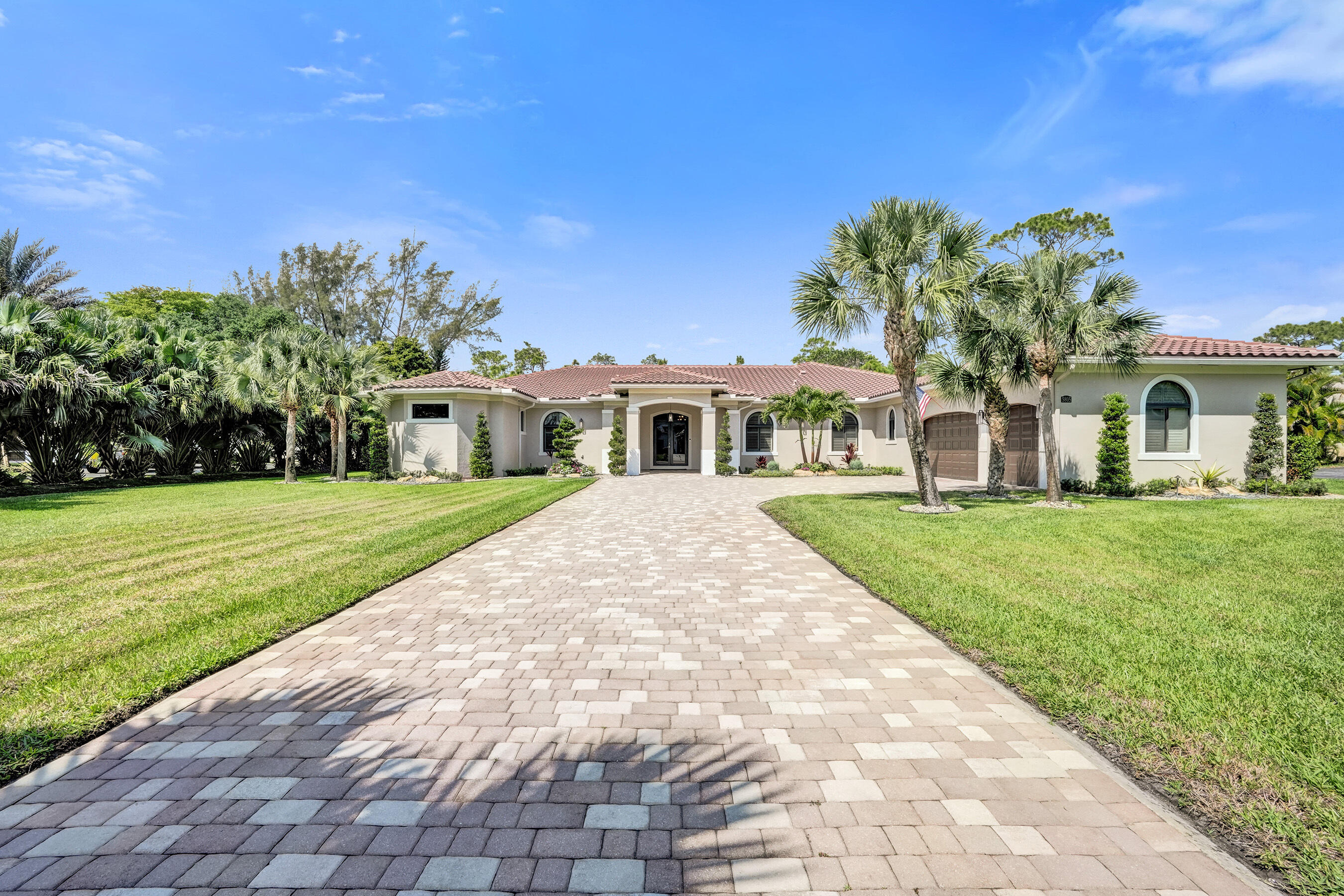 Built in 2017, this custom estate sits on over an acre in one of Parkland's most sought-after communities. This sprawling ranch offers 6 bedrooms, each with walk-in closets/private en-suite bathrooms, along with a dedicated office and a state-of-the-art media room. Designed for both comfort and elegance, the home features marble flooring, formal living and dining areas, a spacious family room, and an oversized laundry room with potential for a secondary kitchen. The recently redesigned gourmet kitchen boasts custom cabinetry, a walk-in pantry, professional-grade appliances, 3 ovens, gas cooktop/griddle, and large center island with seating. Highlights include an oversized reverse osmosis system, new drain fields, 2/5-ton A/C units, impact windows/doors & whole house generator!