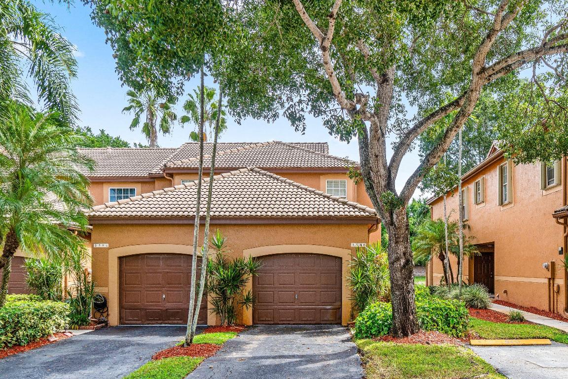 Welcome to 1588 Veracruz Lane, a beautifully updated 2 bedroom & 2.5 bathroom end-unit townhome tucked away on a quiet street with tranquil canal views. This light and bright corner residence offers privacy, comfort, and modern upgrades throughout. Enjoy peaceful mornings on your screened-in patio overlooking the water. Inside, you'll find new wood-look tile flooring, a new stair railing, and an upgraded kitchen featuring granite countertops and space for a cozy breakfast table. Upstairs, the home features two spacious master suites, each with its own private bath. Additional highlights include a one-car garage, private walk-up entry, and abundant natural light throughout. The San Sebastian community offers wonderful amenities including a pool, playground, and pet-friendly environment. Located near top-rated A+ schools, shopping, dining, and with quick access to I-75, this home combines convenience with a serene lifestyle. Low HOA fees and a well-maintained neighborhood make this the perfect place to call home.