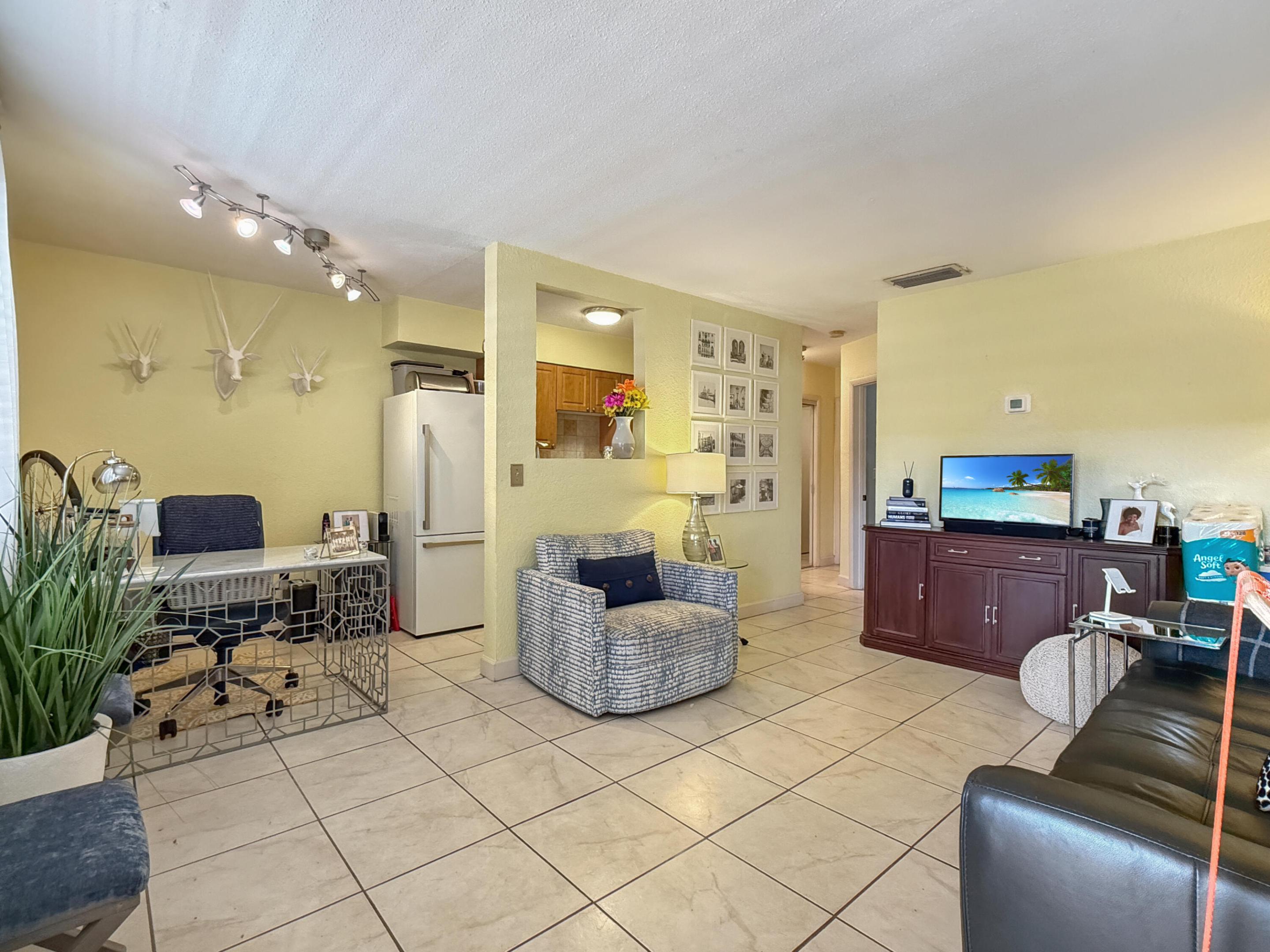 A darling 1/1 condo - just 1.5 blocks  to world renowned Wilton Drive.  Currently rented thru February 2027, so make money IMMEDIATELY after purchase.  2nd floor unit with one dedicated parking space plus lots of guest parking. Community has 2 common area laundry rooms and large pool. Current maintenance fee of $457.86 which includes water/trash/sewer, common area maintenance, property manager, insurance and reserves! No pending special assessments. Easy to see!