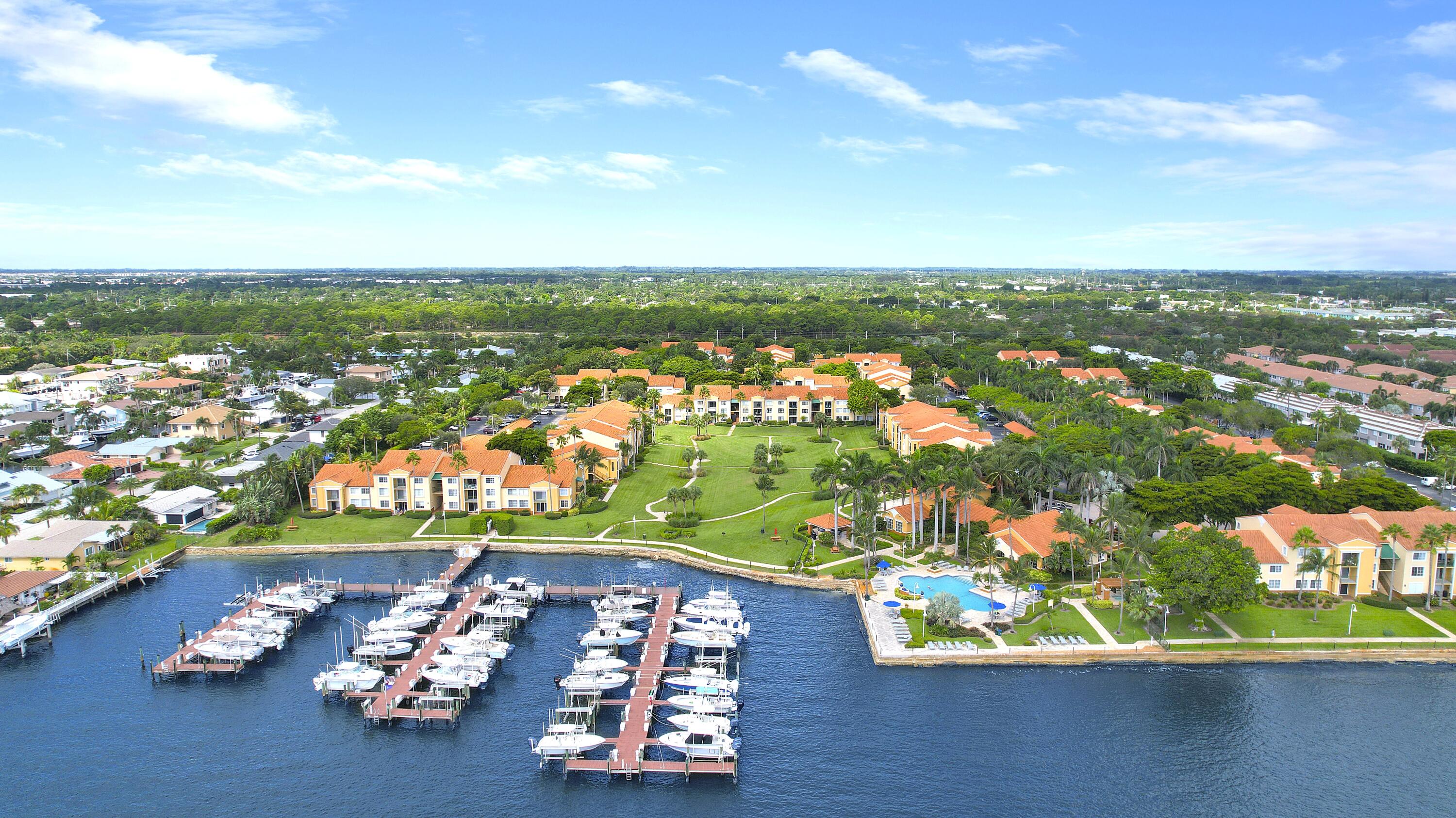 Welcome to fun Florida living at the Yacht Club, a hidden gem on the intracoastal waterway! This lovely two story, 3b, 2.5ba, 1,296sf corner townhome - Yacht Club's largest model - is waiting for you! Remodeled with high end finishes in 2021! Laminate/tile. Modern staircase railing. Quartz counters & ss appliances. New W/D! Plantation shutters/crown molding throughout. Closet built-ins. Hurricane accordions. Fenced private patio. COA includes: Insurance, water, internet, cable & more! Live like you're on vacation year round enjoying two pools w/spa, fitness ctr, tennis/pickleball, outdoor sports/games/grilling, boating, picnic & play areas, serene walking paths, pet park & more!  Best value in the YC!  Winding down after a long day, you'll be happy you chose the Yacht Club!