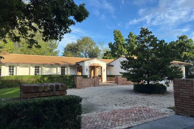 Waterfront estates in Coral Gables with a private dock, three-car garage, and detached guest suite rarely come available — and when they do, the tenants who find them tend to stay. Previously leased long-term by a tenant who extended repeatedly while their home was built — a true testament to how livable this property is. 5100 Granada Boulevard is now available for immediate occupancy for the first time. Set on a nearly 17,000-square- foot fully fenced lot in Coral Gables' prestigious Riviera neighborhood, this 5-bedroom, 5.5-bathroom waterfront estate offers refined living with the mid-century character that new construction cannot replicate. Marble floors, and expansive windows create a seamless flow from the interior living spaces to the outdoor pool terrace and tranquil canal beyond. The private dock provides direct navigable access to Coral Gables' waterway network and Biscayne Bay — launch your boat, kayak, or paddleboard from your own backyard. The resort-style pool is complemented by a covered lounge with ceiling fans, a built-in BBQ and smoker, and generous entertaining space framed by mature oaks and fruit-bearing avocado tree. Fully fenced and completely private — an ideal setting for children, pets, and outdoor living year-round. A detached guest and in-law suite with its own private entrance overlooks the canal, offering exceptional flexibility for visiting, live-in staff, an au pair, a private home office, wellness studio, or creative workspace. The rare three-car attached garage sets this property apart from virtually every comparable rental in the Gables — perfect for car enthusiasts, boat trailer storage, or a home gym. Location is as strong as the property itself: Close to Miracle Mile and Merrick Park, Coconut Grove, South Miami, Downtown Miami, Brickell, and MIA. Top-rated schools, premier hospitals, and everyday essentials all within minutes. Dogs considered. Immediate occupancy.