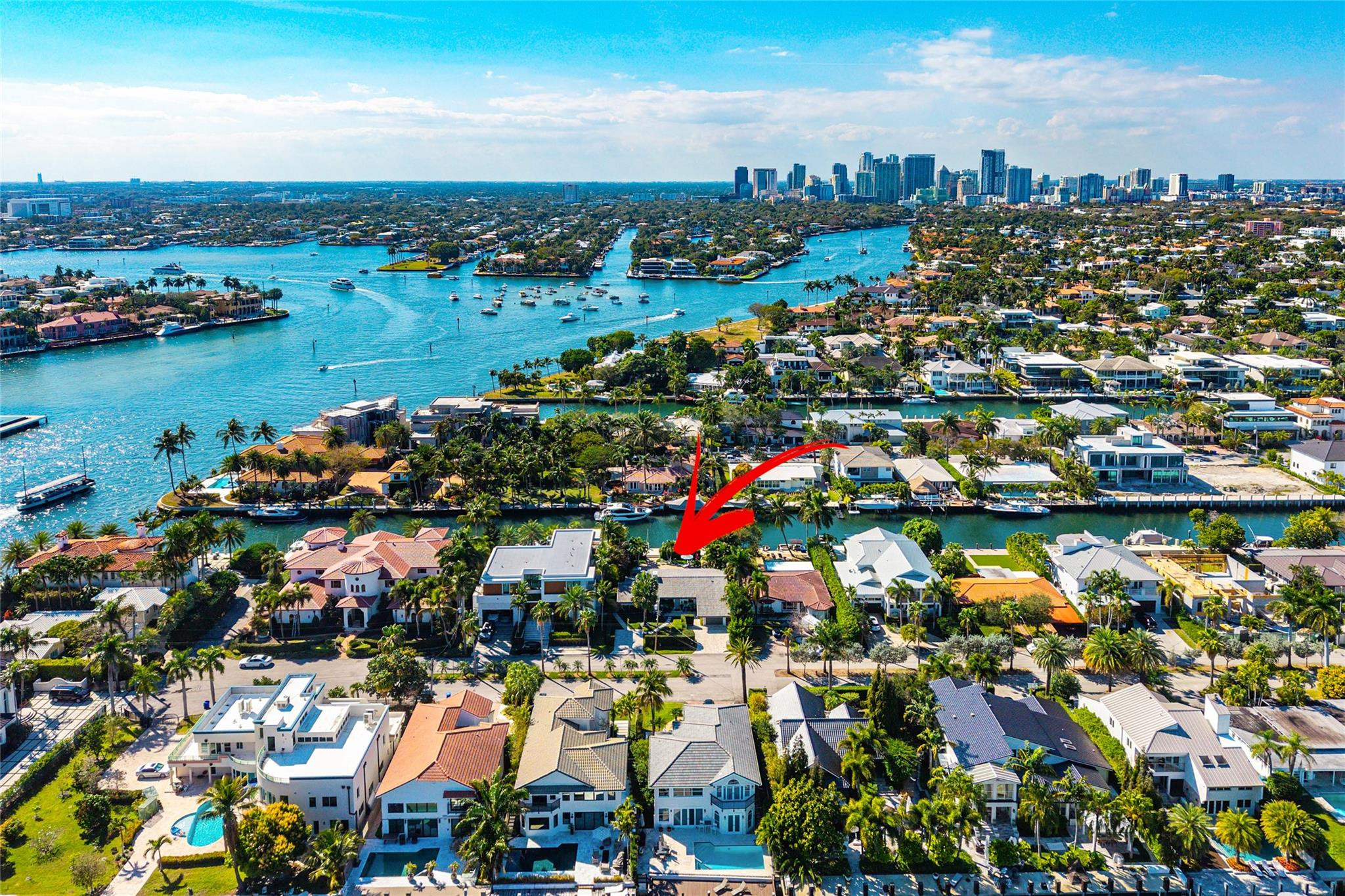 Beautiful single-family waterfront home located in one of the most desirable gated neighborhoods in Fort Lauderdale, Riviera Isles, just off Las Olas Blvd. Enjoy walking distance to Fort Lauderdale Beach, world-class dining, shopping, and entertainment. This property offers 75 feet of prime waterfront dockage with direct ocean access and no fixed bridges—perfect for boaters. Located just under 400 feet from the Intracoastal Waterway and only a 10-minute boat ride to the ocean. The concrete dock, built in 2022, features a 30 K boat lift. Home includes impact-resistant windows and doors, vaulted ceilings, and a spacious L-shaped kitchen designed for entertaining. *If you prefer a new home, then see the pictures of two possibilities on this 75x125 lot.