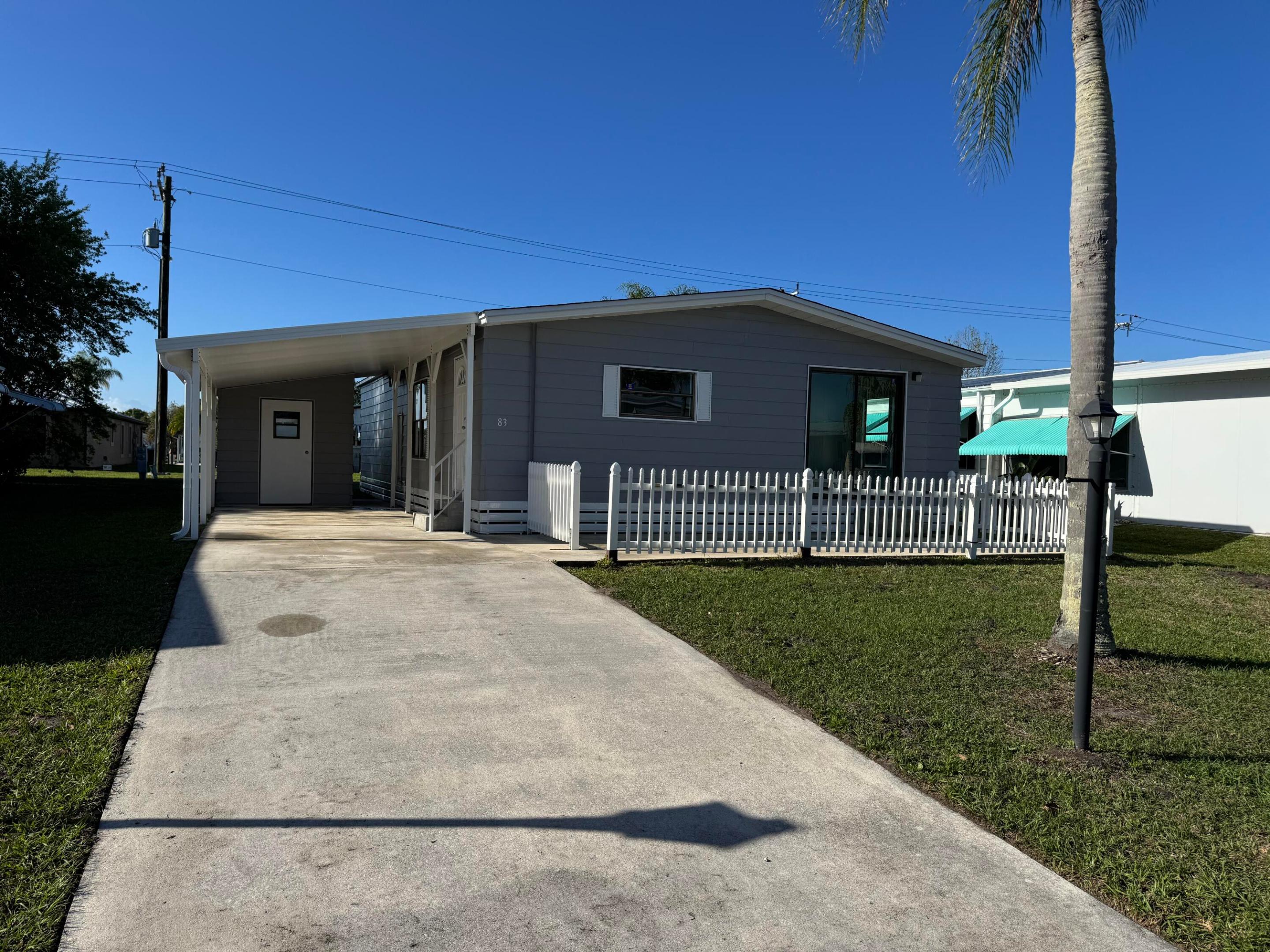 Brand New kitchen, Brand new floors, freshly painted, and ready for move in! LOW LOT RENT $599. You will love this 2/2 with a Flex room. The kitchen will be installed this month (pictures to follow). Spanish Lakes is a highly sought after 55+community offering a private golf course, 2 pools, gym, tennis, Shuffle board pickleball, crafts and so many activities to keep you busy all included in the monthly lot rent.