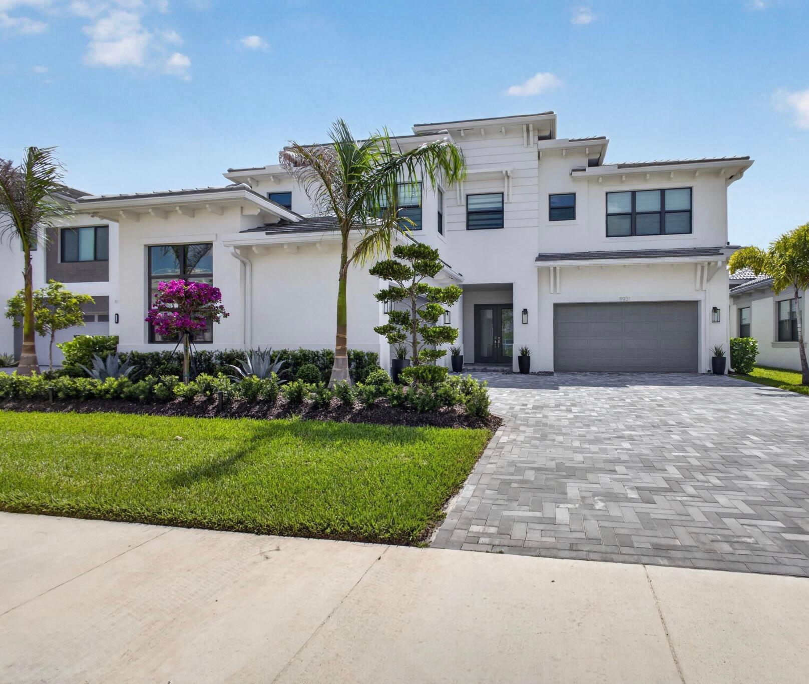 This Is the One You've Been Waiting For. Welcome to 9931 Migration Point -- the most exquisitely upgraded designer model home in all of Avenir at Apex. Set on a premium waterfront lot with a stunning outdoor living area, this is the rare home where every detail has been thoughtfully elevated and nothing has been left to chance.  This is the Zenith, the largest floor plan available at Apex -- 5 bedrooms, 5 full and 2 half baths, and a 4-car garage spanning nearly 7,000 total square feet, with over 5,000 square feet of refined living space. Inside, stunning designer finishes meet a custom-built kitchen made for entertaining, while curated designer touches throughout the entire property deliver a level of craftsmanship and luxury that simply can't be replicated.  A stunning renovation post closing and completely move-in ready, this home comes appointed with custom window treatments, built-out designer closets, and stunning lighting fixtures -- no detail left untouched.  A massive post closing renovation project took this home from one in a crowd to the one that truly stands out, a custom estate home of your dreams!  Waterfront views. Resort-style living. Uncompromising design.  Luxury. Lifestyle. Location. Welcome to Avenir.