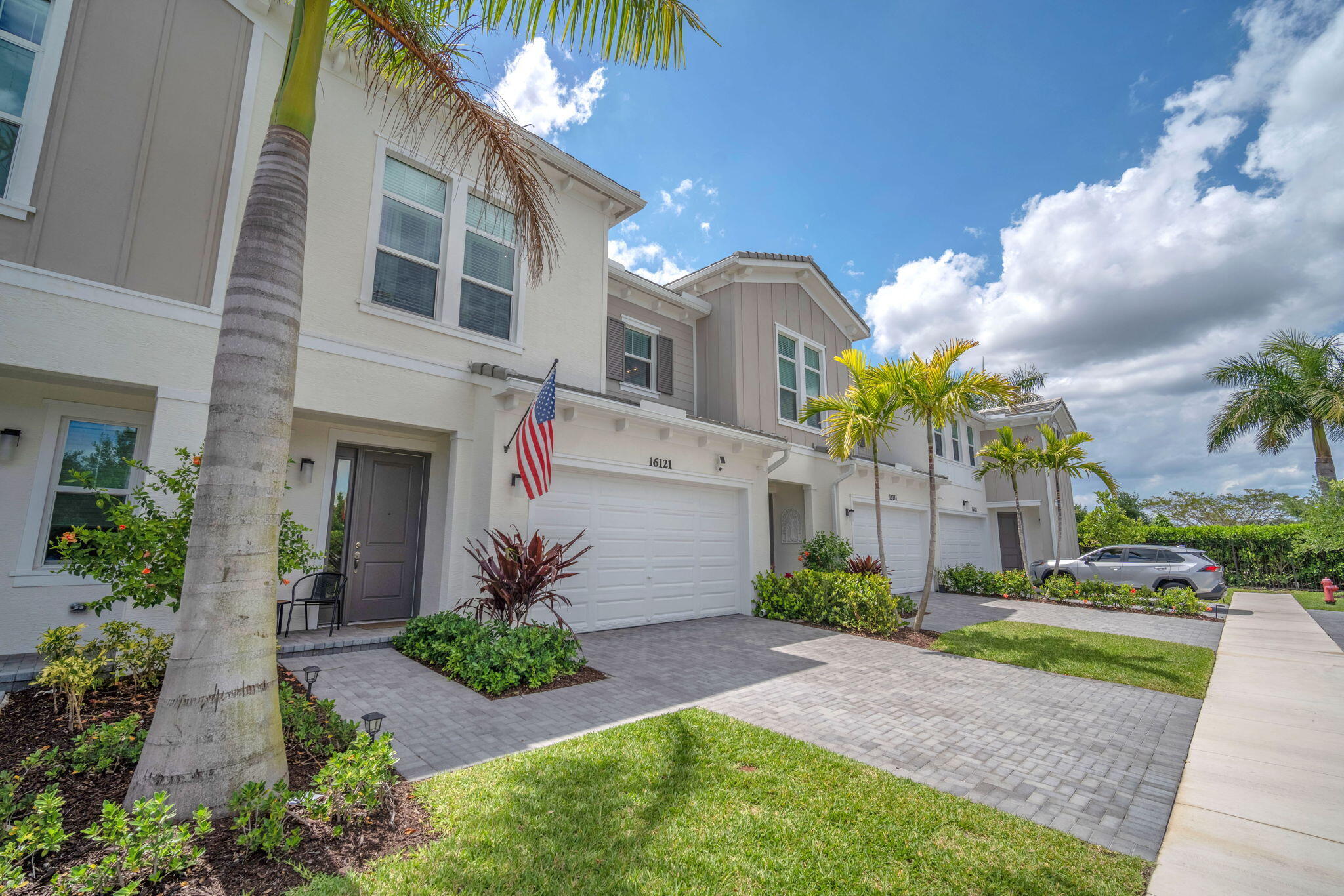 PRICE REDUCTION OVER $50,000 in UPGRADES. The largest model at 2,138 sq. ft. offers more space, premium finishes, and a functional layout that feels like a single-family home. Enjoy a private fenced backyard plus energy-efficient features including impact windows, natural gas tankless water heater, upgraded vinyl flooring, variable-speed HVAC, Ecobee smart thermostat, tile roof, and a 2-car garage with epoxy floor and high end shelving. Custom baby gates upstairs and downstairs with a 500 pound rating. Safe for kids and elderly. Last of this large model being built.   Westlake is a pet- and golf cart-friendly community packed with resort-style amenities, including a BMX Pump Park, Dog Park, lagoon-style pool with a waterslide, splash pad, Snack Shack, private adults-only pool, multiple play parks, greenspaces, a fitness trail, basketball courts, Food Truck Circle, The Lodge, and more! The community hosts monthly family-friendly events, ensuring there's always something fun to do in Westlake with no membership fees!
