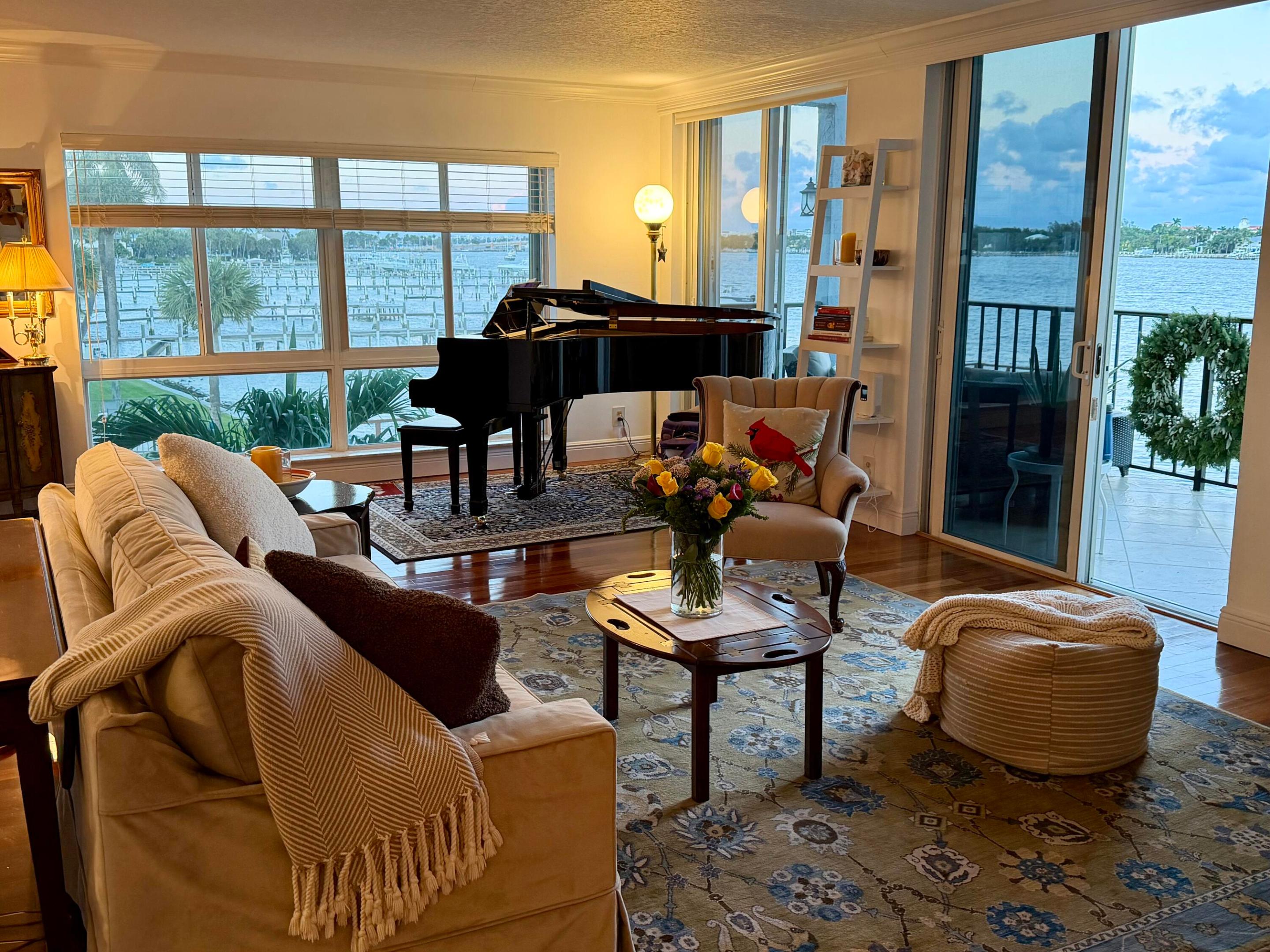 BOATER'S PARADISE!  JUST IMAGINE...WATERFRONT LIVING in this 2 Bedroom - 2&1/2 Bath Intracoastal condo with PANORAMIC water views, facing the DOCK with your own private BOAT SLIP for up to a 30 ft BOAT, and DIRECT OCEAN ACCESS with no fixed bridges.  Rare two-story, third-floor residence featuring impact windows, Brazilian cherry wood floors, an open terrace with sunrises, and water views from every room. Two upstairs waterfront ensuite bedrooms with generous closets. Boutique building with only 25 residences and low HOA fees. Minutes to Palm Beach, beaches, dining, shopping, I-95, and PBIA.