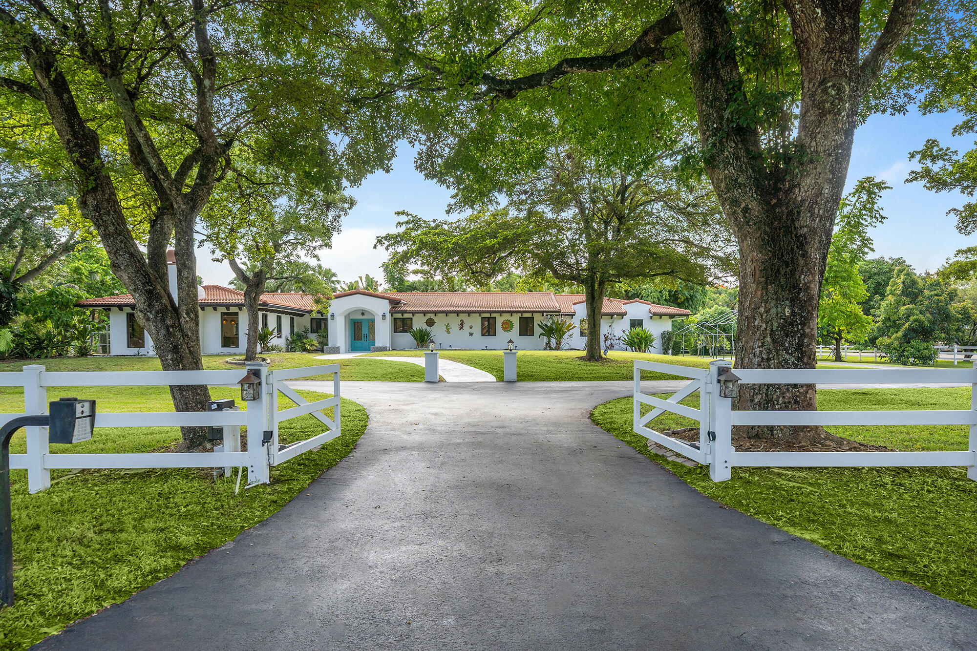 Nestled on a private 1.95-acre corner lot on a prestigious Thoroughbred Ln in the heart of SW Ranches horse country, this renovated 4BR/4BA estate blends timeless design & modern updates, & mature oak & fruit trees. Features include marble flooring in living areas, wood & laminate flooring in BRs & a spacious FR w/ fireplace. Chef's kit offers SS appls, marble island & opens to living areas. Primary suite features cust built-ins & upd bath. Outdoor living w/ oversized heated pool/spa w/ lit water feats, marble paver patio, summer kit, pergola, lush landscaping & sprawling grounds. Enjoy the ranch lifestyle. Addt'l features include impact glass, laundry room, house gen, sec cams, newer 2023 roof & gutters, 500-gal propane tank + 2nd gas tank, septic/drain field, city water, irrigation,  fenced, auto gate,& 2CG. This property's road is also known as Thoroughbred Lane.    Experience the unique lifestyle of Southwest Ranches, one of Broward County's premier acreage and equestrian communities. Known for its rural charm and city convenience, Southwest Ranches features expansive homesites, custom estates, mature trees, scenic paved and unpaved roads, and a strong commitment to preserving its distinctive character and open spaces.  This property offers the added benefit of no HOA restrictions and is zoned for horses and agricultural use, providing exceptional flexibility and privacy. Bring your horses and enjoy the Southwest Ranches lifestyle, with access to nearby riding trails, equestrian facilities, and natural parks.  Residents enjoy convenient proximity to Weston, Fort Lauderdale, Miami, Pembroke Pines, and Davie while maintaining the peace and tranquility of acreage living. Despite its serene setting, Fort Lauderdale-Hollywood International Airport, shopping, dining, and major highways are all within approximately 25 to 30 minutes.  Some properties in Southwest Ranches are serviced by well water and septic systems, reflecting the town's distinctive rural character and commitment to preserving its unique lifestyle.
