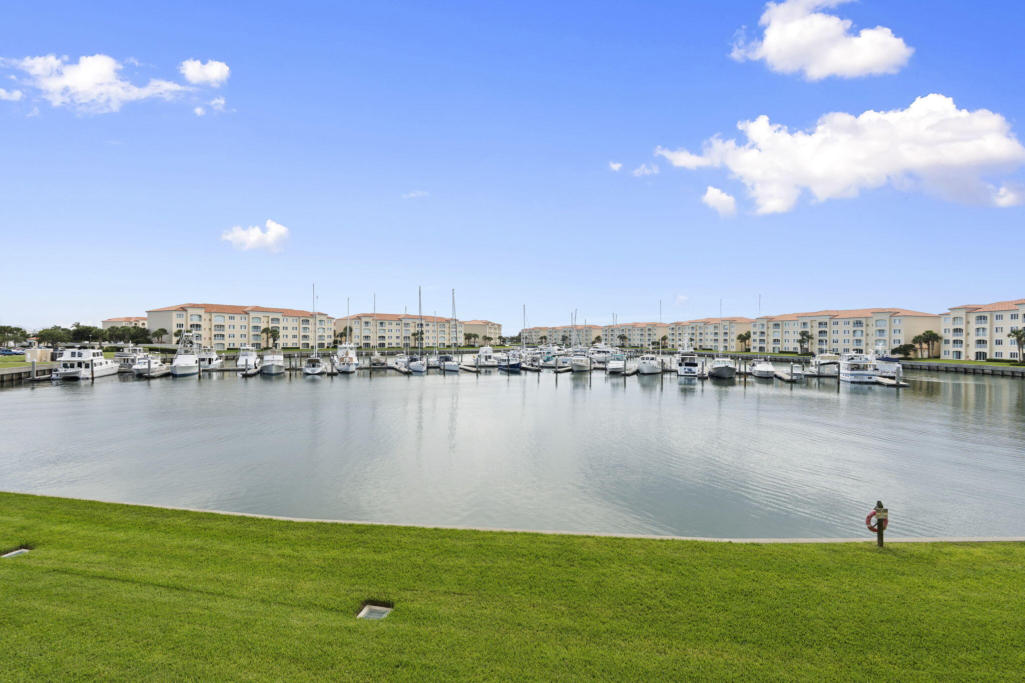 It's all about the view! Enjoy breathtaking marina vistas and watch dolphins, manatees, and boats pass by from your private sunroom. This spacious 2,000+ sq. ft. 2nd floor, end unit condo features 2 bedrooms, 2 baths, plus a versatile bonus room perfect for a home office or guest space. Located in one of South Hutchinson Island's premier gated waterfront communities, you'll enjoy beautiful amenities and an active coastal lifestyle. Walk to the inlet beach, waterfront restaurants, bars, and entertainment, or take advantage of complimentary island transportation. Scenic walking, biking, and jogging paths are just outside your door. More than a home—this is Florida waterfront living at its best.