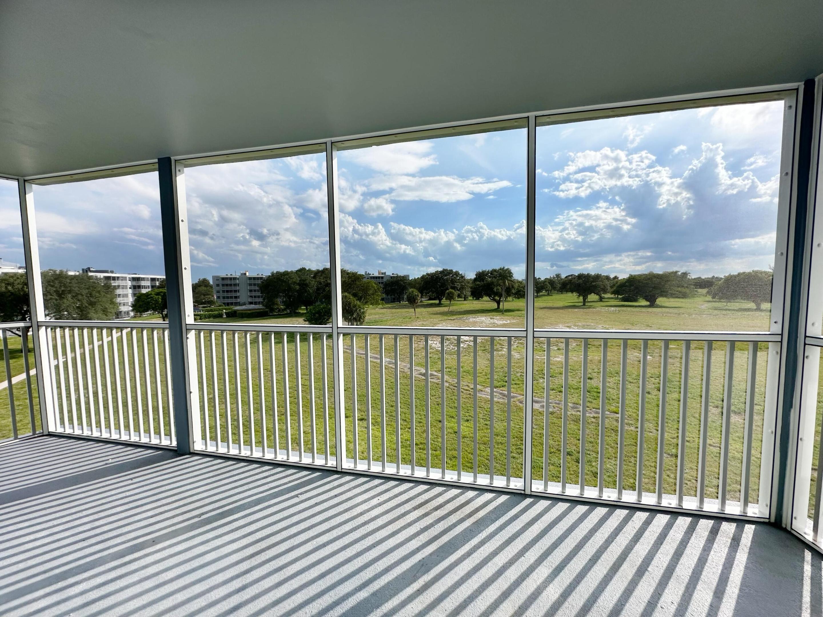 Don't miss this beautifully renovated and freshly painted corner unit in East Boca! This spacious split-bedroom floor plan features 2 bedrooms, 2 baths, and a den with a pull-down bed that can serve as a guest room. Enjoy quality tile flooring throughout, a new A/C (3 years),New master Vanity, new refrigerator, updated appliances - range, dishwasher, and washer/dryer (3 years). Water, INTERNET, and basic cable are included.  Relax on the newly renovated 4th-floor balcony with stunning golf course views and breathtaking sunsets. The community offers a heated pool, grilling area, gated lobby, and excellent security. All-ages community with A-rated schools. Just 5 minutes from the beach, world-class shopping, and fine dining. Experience the East Boca lifestyle at its best!