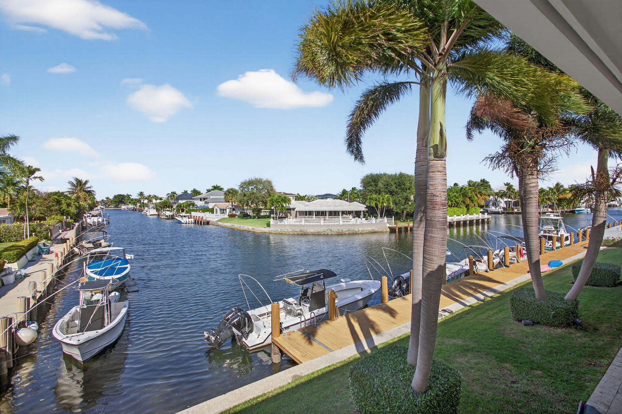 THIS IS IT—your opportunity to own a beautifully updated waterfront condo in the heart of Lighthouse Point! Welcome to Hampton House, a desirable boutique building perfectly positioned along a tranquil canal with sweeping water views and vistas of million-dollar homes. This 2-bedroom, 2-bath corner residence is filled with natural light and showcases thoughtful upgrades throughout, creating a move-in-ready coastal retreat. The spacious living and dining areas feature neutral tile flooring, crown molding, and hurricane impact windows and doors, enhancing both style and peace of mind. The updated kitchen is as charming as it is functional, offering cheerful color cabinetry and stainless-steel appliances with a pass-through to the dining room — ideal for everyday living and entertaining alike. Both bedrooms are generously sized, with the primary suite boasting a refreshed bath complete with granite counters and an updated vanity with vessel sink. Step outside to the large private balcony, where you can unwind while overlooking the canal and dock - true indoor-outdoor Florida living. Boaters will love having direct ocean access with no fixed bridges, plus boat dock lease availability on a first-come, first-serve basis. Additional highlights include a new AC unit in 2022, new water heater in 2025, a waterfront community pool, extra storage unit and on-property laundry room. Located minutes from waterfront dining, shopping, and entertainment, Lighthouse Point is renowned for its peaceful canals, upscale atmosphere, and relaxed coastal lifestyle. This is Florida living at its finest - don't miss your chance to own a stylish waterfront condo in a prime East Coast boating location.