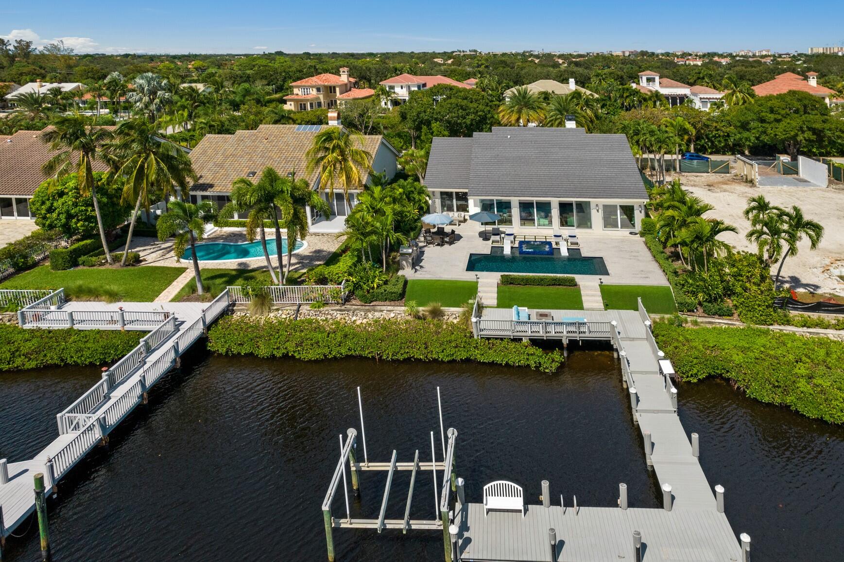 MODEL PERFECT! RARELY OFFERED PRIVATE ISLAND seconds to intracoastal. Recent TOTAL reconstruction and expansion w/contemporary architectural features by renowned designer. One story open concept floorplan w/4 BR/3 1/2 BA/office w/industrial barn door. Brand new flat tile roof. Walls of glass w/10ft impact sliders. Limestone decking surrounds new beach entry salt water pool w/ Pentair System. Southern exposure. Fire Pit Chefs summer kitchen w/pizza oven, grill. Full house generator. Kitchen w/10 x 6ft quartzite center island, stainless steel appliances, smart refrigerator w/glass door, beverage center, gas burners, custom white cabinetry to ceiling. Great room w/soaring ceiling, FP, European hardwood oak floors, sunroom w/shiplap ceiling. Gas lights. PRESS MORE FOR FEATURES THIS HOME HAS IT ALL
ALL NEW 10 FT IMPACT SLIDERS W/SCREENS

LUTRON MOTORIZED SHADES FOR ALL SLIDERS, PRIMARY BEDROOM AND OFFICE

NEW SALT WATER BEACH ENTRY POOL W/PENTAIR HEATER AND SPA

PRIME SOUTHERN EXPOSURE

OUTDOOR LIMESTONE DECKING W/FAUX TURF

SECOND LEVEL DECKING W/SEATING AREA AND GAS FIRE PIT

POOL SPEAKERS, PLENTIFUL LANDSCAPE LIGHTING

DOCK FOR UP TO 50 FT BOAT AND LIFT SECONDS TO INTRACOASTAL

LARGE SUMMER KITCHEN WITH PIZZA OVEN, GRILL WITH ROTISSERIE, STORAGE AND GRANITE COUNTERTOP

OPEN CONCEPT FLOOR PLAN WITH SOARING CEILINGS AND EXPANDED SUNROOM WITH SHIPLAP CEILING

SURROUND SOUND THROUGHOUT

CONTEMPORARY DESIGNER MINKA FANS

SOLID WOOD 8 FT DOORS WITH EMTECK HARDWARE AND HINGES

PRIMARY BEDROOM AND GUEST BEDROOMS WITH CUSTOM CLOSETS

PRIMARY BATH FEATURES 7FT X 5 FT WALK IN SHOWER WALL WITH MOSAIC QUARTZ INLAY, BODY SPRAYS, RAINHEAD, FREE STANDING TUB, CUSTOM CABINETRY 

OPEN CHEFS KITCHEN WITH 10 FT X 6 FT QUARTZITE ISLAND W/STORAGE, TOP ZERO STAINLESS STEEL SINK, WINE FRIDGE, BREAKFAST BAR

STAINLESS STEEL APPLIANCES INCLUDING SMART GLASS DOOR REFRIGERATOR, GAS BURNERS WITH STAINLESS STEEL VENT

QUARTZ COUNTERTOPS W/5 1/2 FT CUSTOM CABINETRY, STACKED SUBWAY PORCELAIN TILE BACKSPLASH

BEVERAGE CENTER WITH STAINLESS STEEL DOORS

FLOOR TO CEILING HURRICANE GLASS ENTRY DOOR TO FOYER

OFFICE WITH INDUSTRIAL BARN DOOR

LARGE LAUNDRY ROOM WITH SINK, LOADS OF CABINETRY FOR STORAGE AND WOOD AND PORCELAIN FLOOR

AIR CONDITIONED GARAGE WITH PEBBLE TEC FLOOR AND BRAND NEW IMPACT GARAGE DOORS

FULL HOUSE GENERATOR