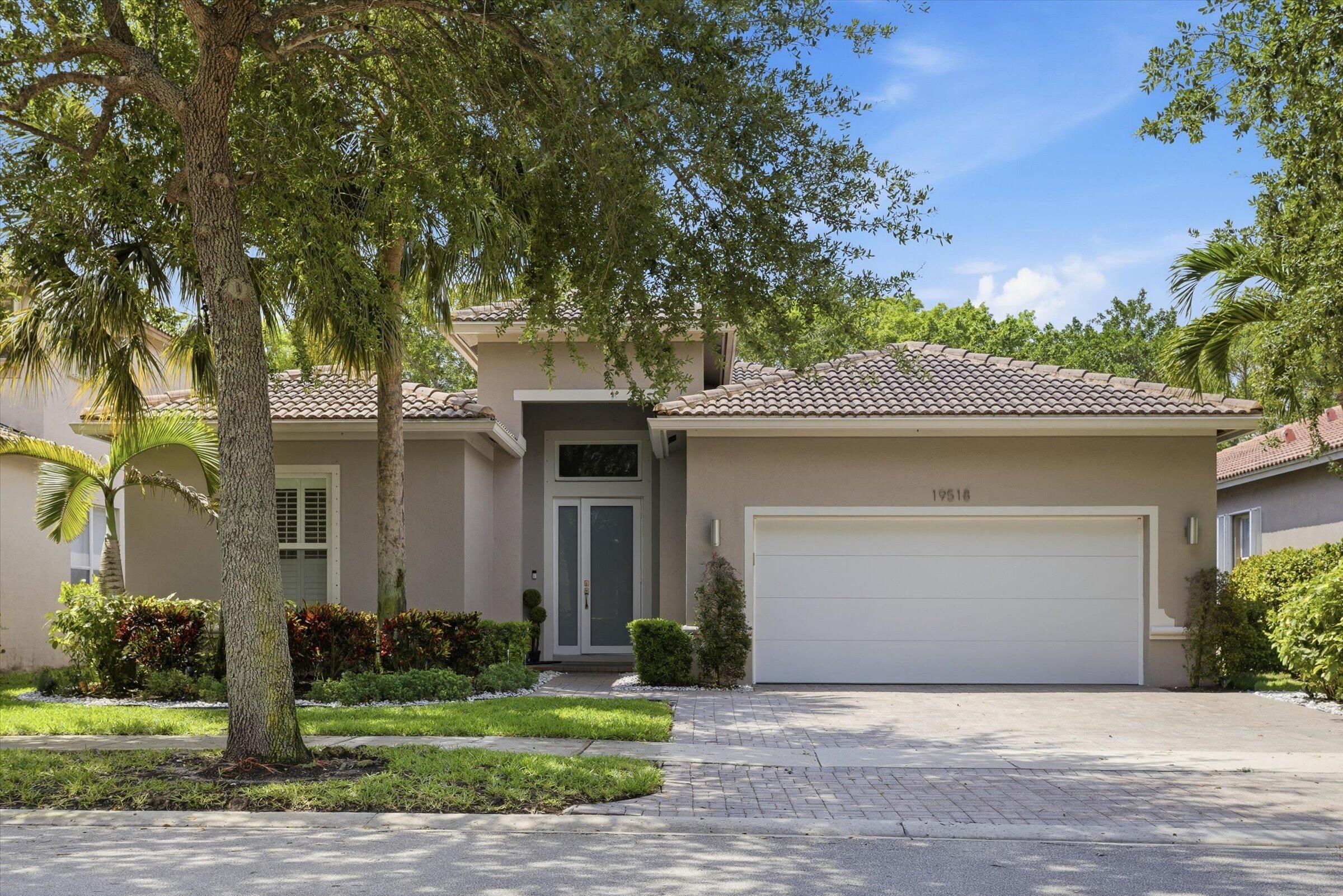 Tastefully renovated 4BR/3BA home in desirable Isles at Weston! This move-in ready property features a dream chef's kitchen with top-of-the-line appliances, oversized peninsula, custom cabinetry, and an open layout perfect for entertaining. Beautiful laminate wood floors throughout, updated bathrooms, impact windows and doors, laundry room, and an extended patio ideal for outdoor living.  Spacious split-bedroom floor plan offers privacy and functionality. Enjoy a very private backyard with no neighbors behind the property. Room for pool. Located in one of Weston's most sought-after gated communities with great amenities and top-rated schools.  Gated community with renovated clubhouse, gym, pool, park, volleyball, basketball & social rooms. a must see!!