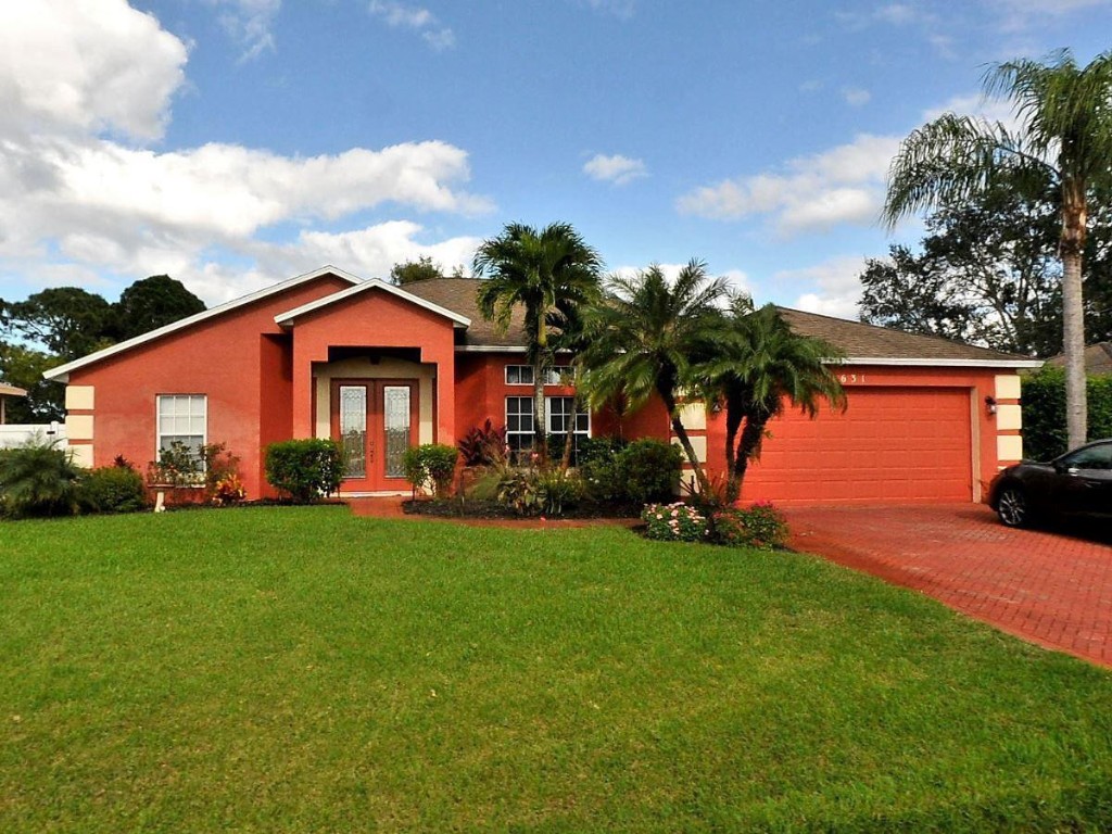 Don't miss out on this perfect FL Home. The main house is a 3 bedroom & 2 bathroom and the separate guest, in-law suite is a 1 bedroom & 1 bathroom. Location is prime as it is blocks from Jessica Clinton Park and the C24 canal boat ramp with direct ocean access, schools, shops and a short drive to the beaches. The heated screened in salt water pool is perfect for entertaining.  The roof is approximately 1.5 years old, home has an air scrubbing/cleaning system w/ultraviolet light, a split floor plan, tile floors styled to look like wood, granite counter tops, stainless steel appliances, formal dining and kitchen, cabana bath, outdoor shower, volume ceilings, roman tub, plush landscaping, 2 car garage, fenced yard. Bring offers!