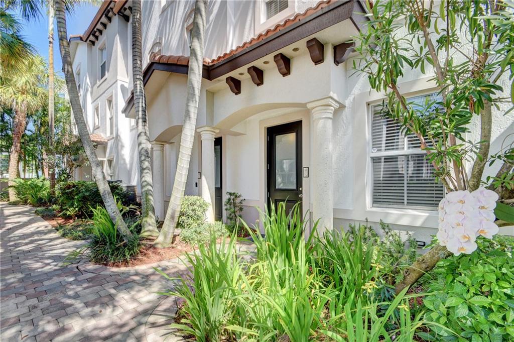This luxurious oasis in East Boynton is nestled on the tranquil intracoastal and boasts top-notch amenities! This home offers plenty of space, style and convenience — featuring a full bedroom and bathroom on the main level, along with a spacious living area, stunning kitchen with wood cabinetry, stainless steel appliances and balcony access. Upstairs are two sweeping master suites and the handy laundry room, all dressed in sleek, contemporary flooring with impact-resistant glass windows and fittings throughout. This exquisite property has been meticulously maintained with designer lighting and window coverings installed throughout. Kick back in the resort-style pool, take in the serene water views from the fitness center and enjoy the outdoor space. It's everything you've been looking for!