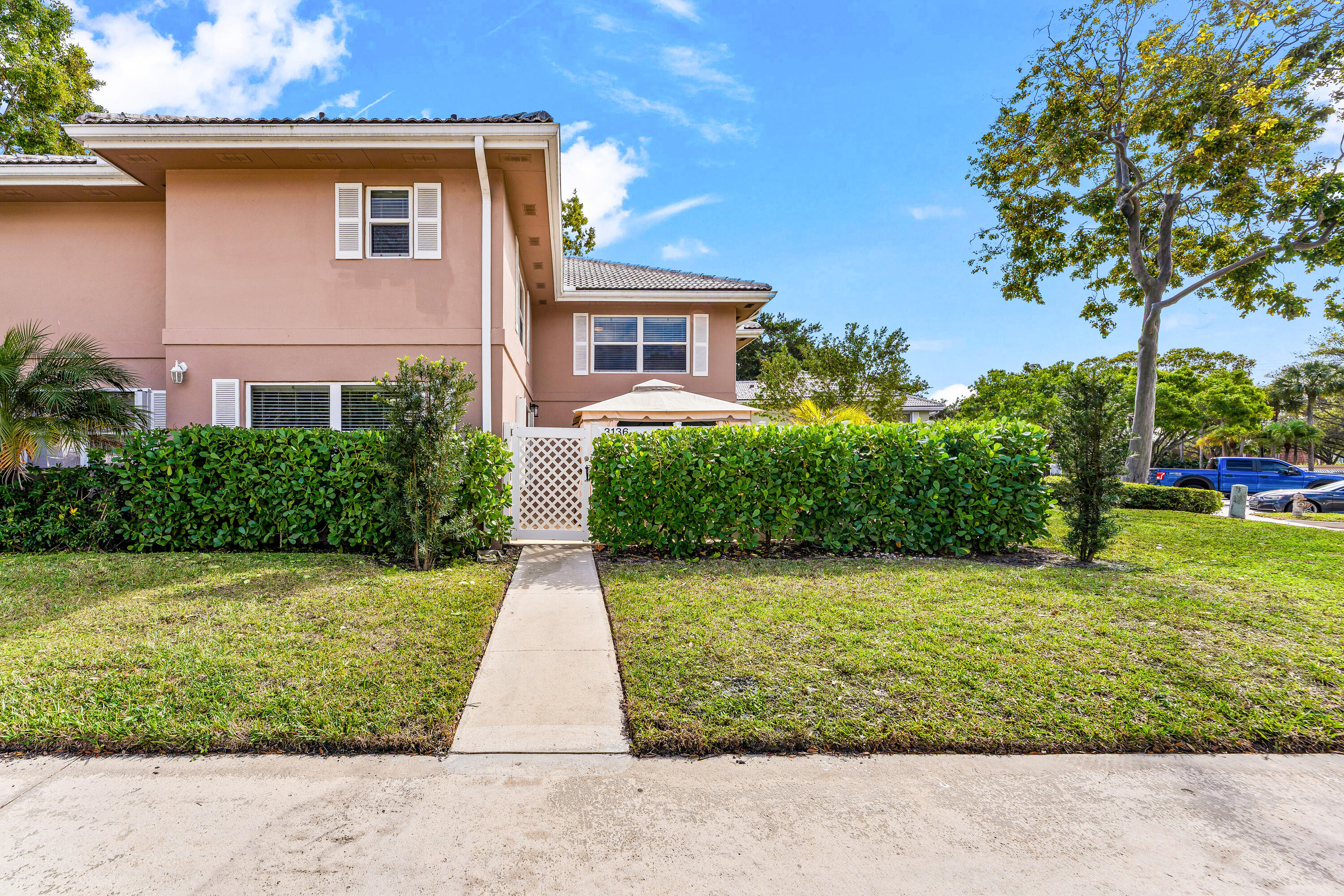 Welcome to a charming quiet townhouse in West Palm Beach featuring privacy hedges, FULL IMPACT windows and doors two spacious bedrooms and two and a half tile bathrooms with laminate wood floors through out the home. The townhouse has an open-concept living area, great for entertaining and a modern kitchen equipped with quality appliances and ample storage. Enjoy outdoor relaxation on the private patio conveniently located near shopping, dining, and recreational areas, This townhouse combines comfort and accessibility for a delightful living experience.