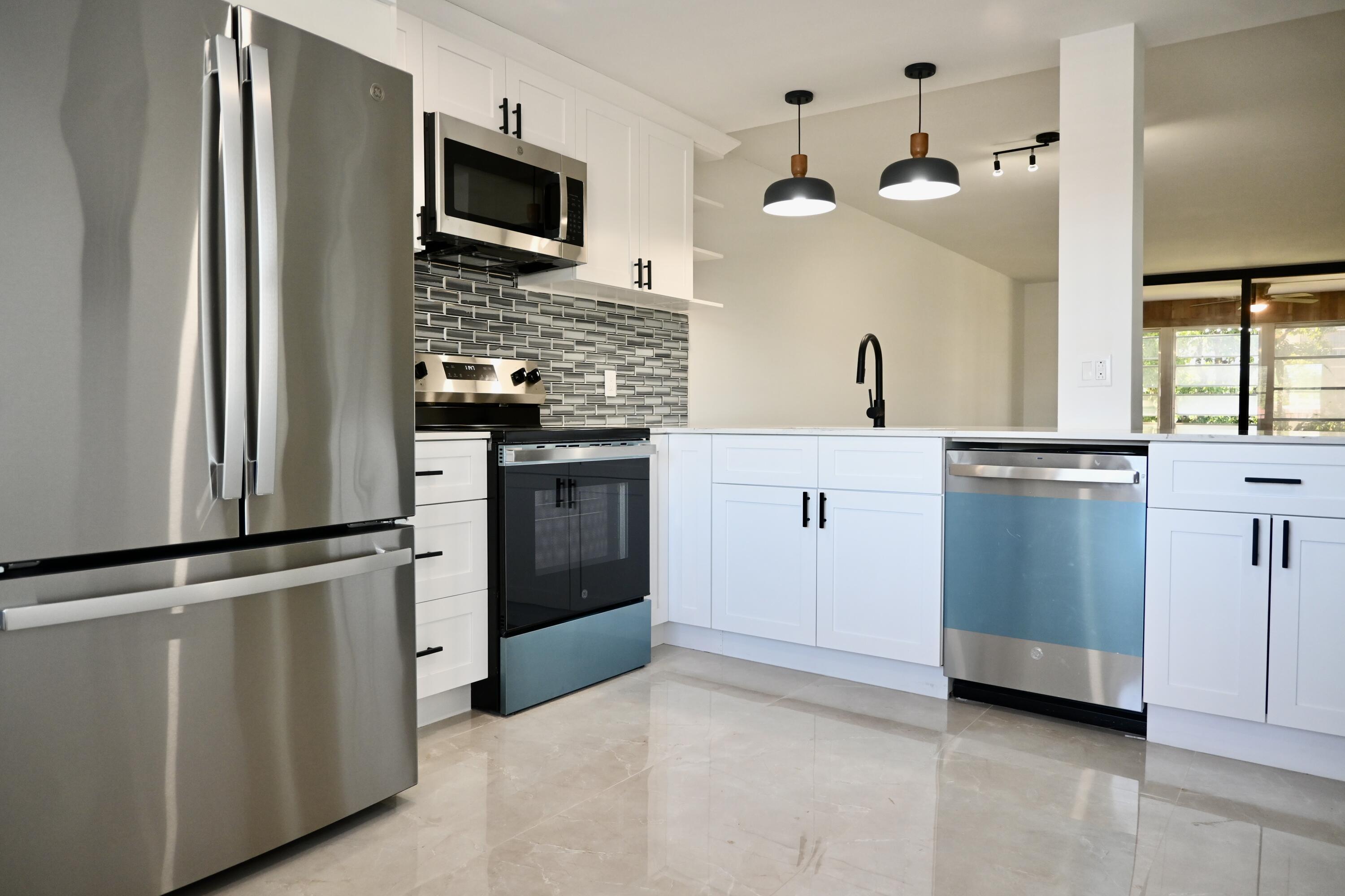 FINANCING AVAILABLE! Seller willing to assist with closing costs or an interest rate buydown. Completely remodeled 2BR/2BA that's truly move-in ready! Features brand-new GE stainless steel appliances, custom cabinetry, porcelain tile flooring throughout, recessed LED lighting, modern interior doors, designer vanities, tankless water heater, full-size washer & dryer, and high-end finishes throughout. Enjoy resort-style living in a financially stable, well-maintained community with brand-new elevators and a spectacular newly renovated clubhouse featuring a fitness center, ballroom, library, card & game rooms, resort-style pool, hot tub, and more. HOA includes insurance, water, cable, sewer, trash, and all amenities. Exceptional value, low-maintenance living. Schedule your showing!