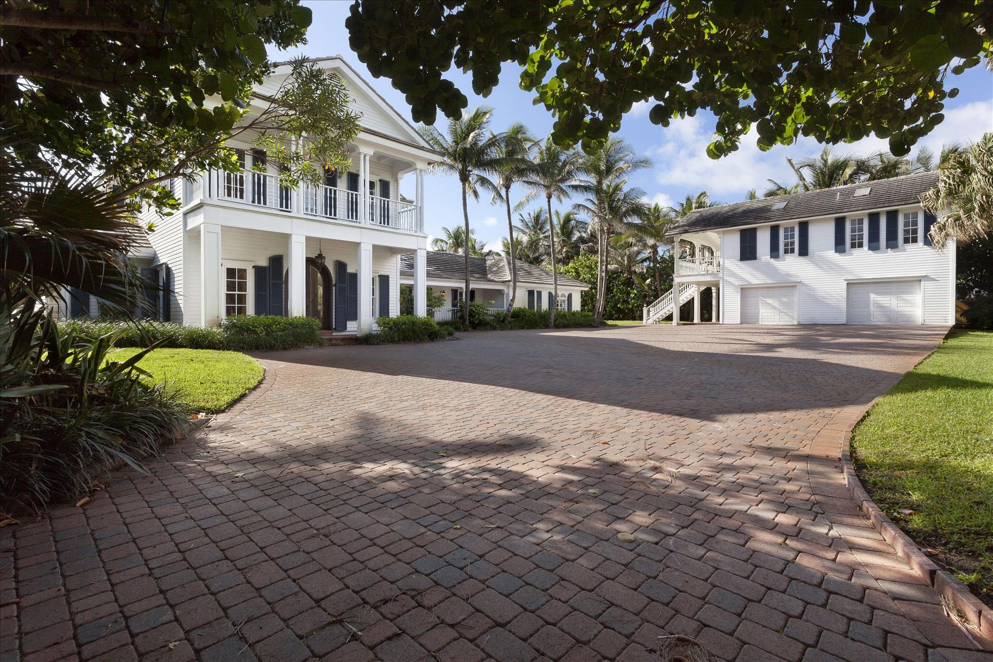 Oceanfront Property with 158 +/- feet of beachfront in Ocean Ridge. This one and one-half acre property offers an opportunity to build your oceanfront dream home or renovate the existing estate. The information herein is deemed reliable and subject to errors, omissions or changes without notice.  The information has been derived from architectural plans or county records. Buyer should verify all measurements***SEE SUPPLEMENT*** Endless views of the Atlantic Ocean create an oasis of tranquility for this rare direct oceanfront estate in Ocean Ridge, an exclusive oceanfront hamlet that carefully maintains the quiet, low-key character and low density that make it one of the Gold Coast's best-kept secrets.  Lush foliage and privacy hedges along the perimeter of this walled and gated estate add to the established feel and sense of seclusion on the 1.65±-acre property notable for its substantial size and 158± feet of magnificent oceanfront.

Set back from Ocean Boulevard by a long private drive on the sweeping lawns, the classic five-bedroom coastal-style residence and separate garage with an upstairs guest apartment create a compound-like estate in this idyllic dream setting perfect for a new custom residence or a renovation.  The 19±-foot elevation of the property gives an even more glorious wide-open perspective overlooking the sparkling blue waters.  Stretching 460± feet deep, the sprawling grounds extend the lawns to the dunes, where a walkover steps down to the sun-drenched sugar sands.  A truly extraordinary opportunity, this prized direct oceanfront estate enjoys the serenity and seclusion of Ocean Ridge in the heart of South Florida's fabled Gold Coast, only a few miles north of Delray Beach and about 12 miles south of Palm Beach.

Location
North Ocean Boulevard, Ocean Ridge, Florida.  One of the Gold Coast's best-kept secrets, the prestigious hamlet of Ocean Ridge offers rare Old Florida serenity on the barrier island between the Atlantic Ocean and Intracoastal Waterway.  In its idyllic natural setting, Ocean Ridge offers a relaxed atmosphere and carefully maintains its low-key, low-density profile.  Several picturesque parks within the town of Ocean Ridge are nestled on the shores of both the Atlantic Ocean and Intracoastal Waterway.  Just a few miles south of Ocean Ridge, historic Delray Beach provides wonderful boutiques and bistros in its vibrant downtown district, centered on famous Atlantic Avenue.  In the heart of South Florida's Gold Coast, Ocean Ridge is also centrally located between Palm Beach and Boca Raton, both of which offer world-class shopping, dining and entertainment.  Palm Beach International Airport is a convenient 20±-minute drive from Ocean Ridge.

Property
Directly fronting 158± feet on the ocean, this compound-like estate sits on 1.65± acres enclosed by privacy walls and hedges with a gated entrance.  Capturing inspiring views and balmy breezes, this sprawling property provides the ultimate setting to custom build a new oceanfront dream residence or renovate the existing home.  This two-story residence opens to oceanfront verandahs on both levels, stepping out to the pool terrace and spacious lawns leading to the private dune walkover.

Residence
This classic coastal-style residence comprises a total of 6,156± square feet, including the separate two-bay garage with guest apartment above, and provides five bedrooms and five full baths in the main house.  The hardwood-floored living room is across from the dining room which flows through French doors to the oceanfront verandah.  Also opening to the verandah and oceanfront grounds, the kitchen and family are combined in a large open great room with beamed cathedral ceiling and Mexican tile floor.  The kitchen appliances include a gas range.  Two bedrooms and three full baths are also situated on the main level.   One of these bedrooms overlooks the ocean and is served by its own en-suite bath.  Upstairs, the oceanfront master suite opens to the verandah and mesmerizing ocean view, and has a private marble bath.  Two more bedrooms, one opening to the oceanfront verandah, are served by another bath.



Disclaimer: The information provided herein including but not limited to measurements, square footages, lot sizes, calculations and statistics have been obtained and conveyed from third parties such as the applicable Multiple Listing Service, public records as well as other sources. All information including that produced by the Sellers or Listing Company are subject to errors, omissions or changes without notice and should be independently verified by any prospect for the purchase of a Property.  The Sellers and Listing Company expressly disclaim any warranty or representation regarding all enclosed information.  Prospects' use of any information herein is acknowledgement of this disclaimer and that Prospect shall perform their own due diligence.  Prospects shall not rely on this information when entering into a contract for sale and purchase.  Some affiliations may not be applicable to certain geographic areas. If your property is currently listed, please do not consider this a solicitation.   In the event a Buyer defaults, no commission will be paid to either Broker on the Deposits retained by the Seller. "No Commissions Paid until Title Passes."    Buyer pays title insurance, Florida documentary stamps, and all other closing costs for New Construction and land use. Copyright 2016 Listing Company.  All Rights Reserved.