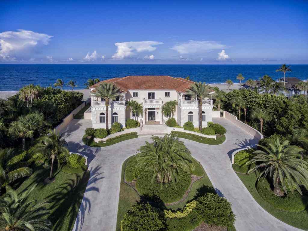 This definitive oceanfront estate brings unsurpassed elegance to the shores of the Atlantic. The home's gracious exterior welcomes guests to beautifully appointed living spaces which flow seamlessly in a subtle blend of natural tones, and are at once grand yet intimate. Custom finishes abound, from rich paneling and cabinetry throughout to deeply coffered ceilings, marble flooring and countertops, distinctive textured wall coverings and intricately detailed moldings.  Immediately accessible from the home's living spaces are an expansive swimming pool and lanai including a cabana bath and outdoor kitchen with covered seating.  Breathtaking ocean vistas are captured from nearly every setting. This incomparable estate brings together uncompromising craftsmanship and design.