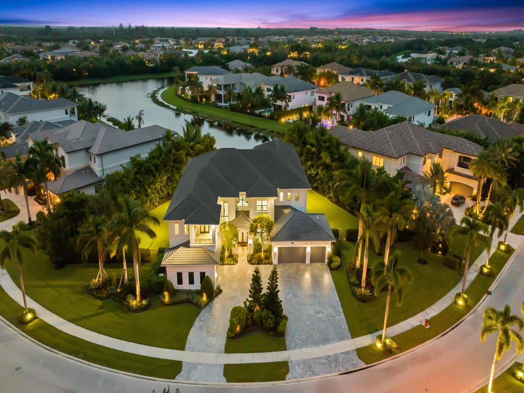 This Special Expanded Vanderbilt Grande model is Lakefront, on a 3/4 Acre 'double' lot!! Offering 6 bedrooms, plus loft, office, media room, 8 full & 2 half baths, 2 laundry rooms, 5 car garage, the estate style home totals 11,567 sq ft (8,017 under air) surrounded by wide lake views and lush, treed, mature and newly planted garden vistas. Retreat outdoors with all the comforts of home using telescoping impact doorwalls off living room, to exterior dining space & summer kitchen. Optional motorized privacy screens compliment the space.  Enjoy fabulous sunsets from sprawling patio & balconies, salt water pool & spa with heater/chiller, private putting green, fenced green space for playground or dog run.
Home Upgraded throughout. Indoor elevator. Home generator. Water filtration. EV charger Whole home water filtration.
