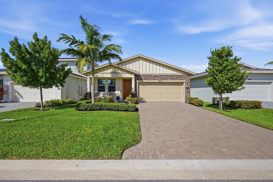 Welcome to luxury living in Delray Trails! This stunning brand-new 3-bedroom, 2-bath home features modern construction with full impact windows throughout, upgraded wood-look tile flooring, and soft-close cabinetry for a refined finish. Enjoy tranquil lake views and a bright, open layout perfect for everyday living and entertaining. Delray Trails is raising the bar with a brand-new clubhouse opening soon, set to rival any premier community, offering three resort-style pools, fitness and social spaces, and endless activities. Ideally located near shopping, dining, and beaches, this move-in-ready home delivers security, style, and resort-style living at its finest.