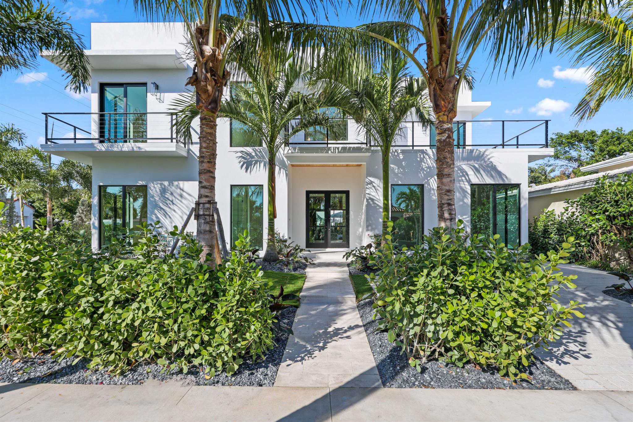 BRAND NEW CONSTRUCTION 2025 ON INTRACOASTAL BLOCK! 5-Beds + Office / 6.1 Baths - This stunning 5,000 SF home exudes sophistication and elegant indoor-outdoor living accessible with expansive sliding pocket doors. Featuring exquisite light oak hardwood floors, Thermador appliances/gas range, gracious butler's pantry, multiple spacious terraces, and custom closets, every detail. The beautifully designed loggia, summer kitchen and heated pool and spa create the perfect setting. Prime location in the desirable 'SOSO' South of Southern neighborhood is close to everythingâ'' minutes Palm Beach Island, PB International Airport, and The Square/CityPlace). This home is surrounded by top-rated public and private schools. Don't miss this incredible opportunity to live in one of Palm Beach's most... desirable locations.