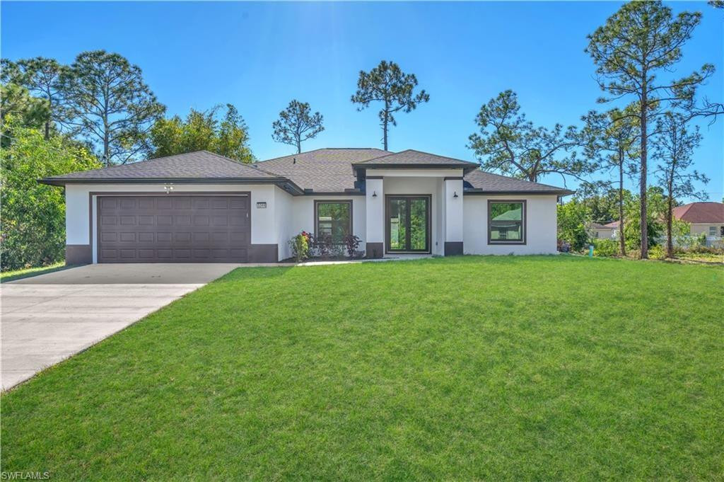 Brand-new construction with modern finishes and a smart, functional layout. This 4-bedroom + den, 2-bath home features an open-concept design with high-gloss tile flooring, designer lighting, and a clean contemporary feel. The kitchen offers custom cabinetry, quartz countertops, stainless steel appliances, and a bold backsplash, flowing into the main living area—ideal for entertaining. The primary suite includes a spa-style bath with a walk-in shower. Covered lanai, spacious yard, 2-car garage, impact windows. Adjacent lot also available to create a half-acre homesite. Move-in ready.