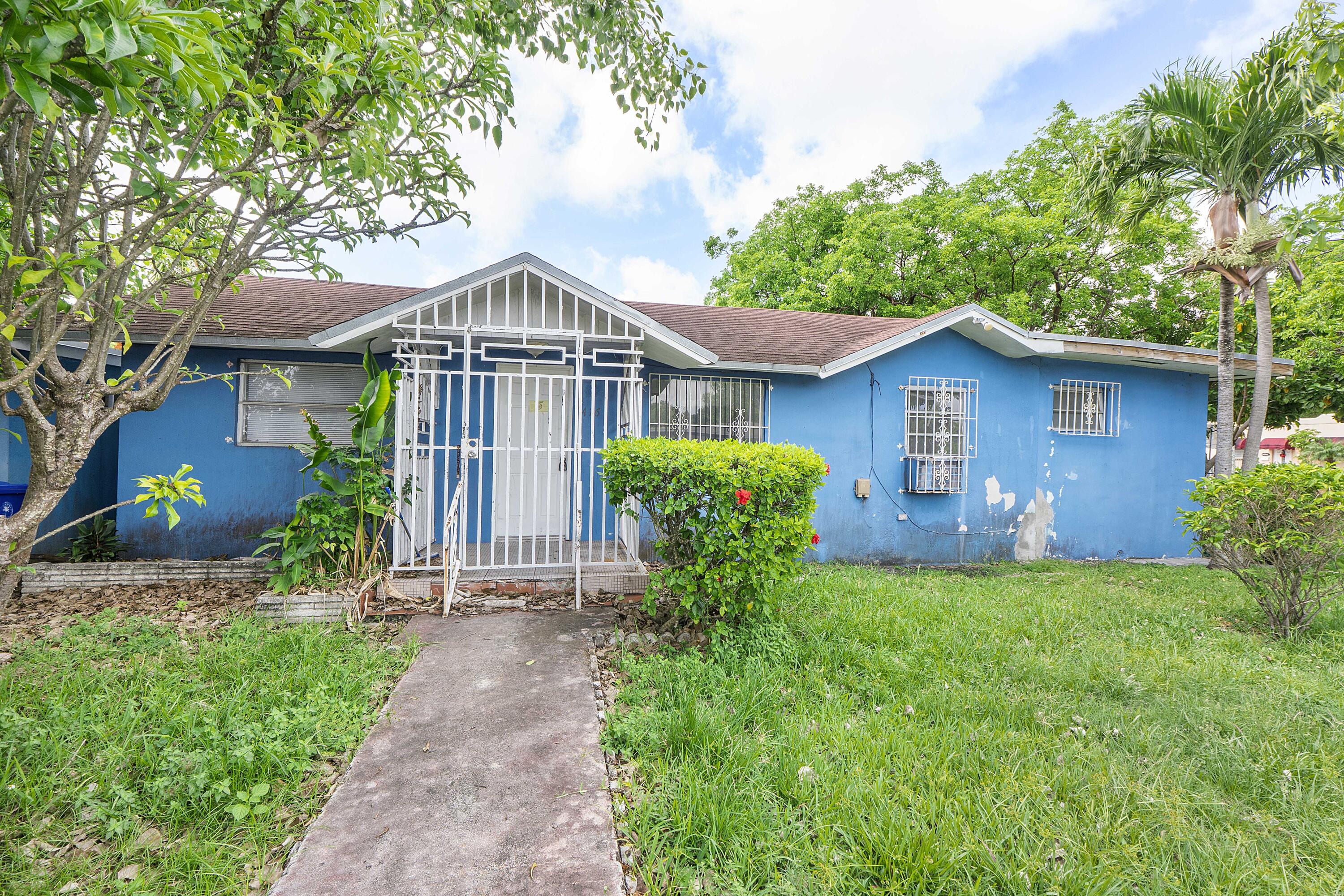 Charming opportunity in the heart of Miami! This 2-bedroom, 1-bath home offers 1,424 sq ft of living space with plenty of potential to make it your own. Surrounded by mature trees and lush greenery, the property features a fenced front yard, spacious layout, and functional kitchen with ample cabinet space and stainless steel appliances. Ideal for investors, first-time buyers, or anyone looking to customize a home in a convenient Miami location. Enjoy easy access to major highways, shopping, dining, and schools. Don't miss this chance to bring your vision to life in a centrally located property with endless possibilities!