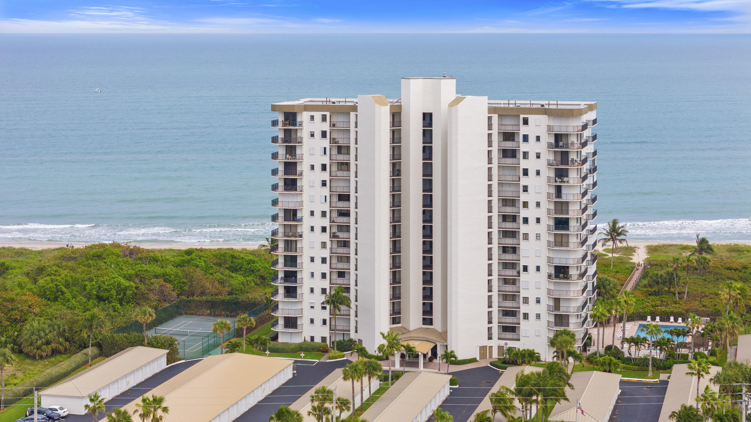 RARE 3 BEDROOM/2BATH CORNER UNIT WITH TWO GARAGES! Step inside to discover brand new luxury vinyl plank flooring and fresh paint throughout with sweeping views of the ocean and dunes. The spacious living area flows effortlessly into a private balcony perfect for enjoying sunrises over the water. Both guest bedrooms also offer balcony access. The newly updated primary bathroom features contemporary finishes and a serene spa-like feel. Whether you're looking for a full-time residence, vacation getaway, or investment opportunity, this corner unit combines location, luxury, and lifestyle. Don't miss your chance to own a piece of paradise!