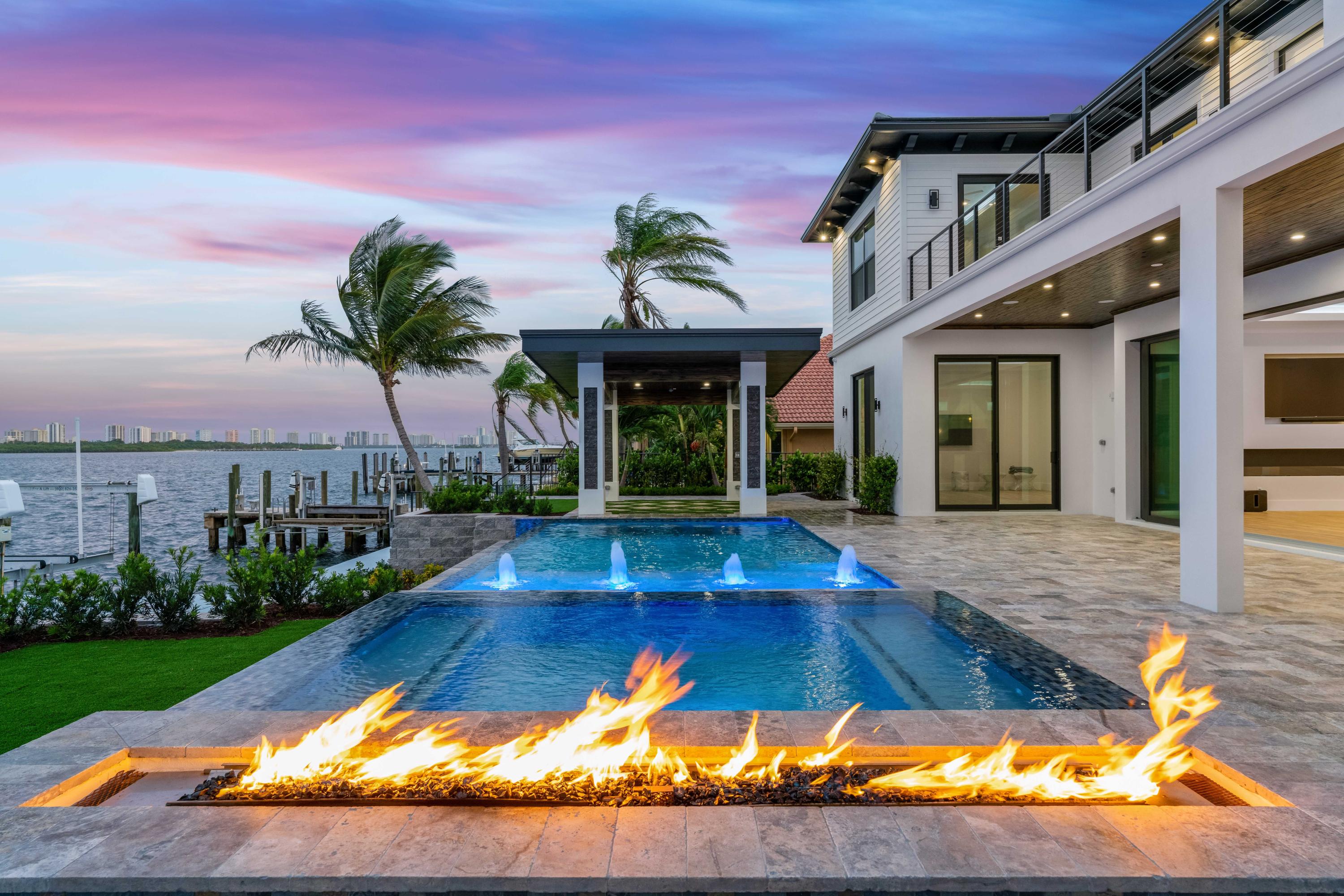BRAND NEW WATERFRONT CONSTRUCTION developed by High Tide Waterfront Properties! Located in the coveted Yacht Club neighborhood of North Palm Beach on direct Intracoastal with NO FIXED BRIDGES! This 5 bedroom, 6 bath house boasts stunning views of John D. MacArthur State Park and Singer Island. First floor AND second floor master suites, elevator, open floor plan with linear fireplace and lighted coffered ceilings, wired for smart home, sound and security. Pool with infinity edge, spa and covered patio area with waterfall. This home has it all! Virtual showings available upon request.