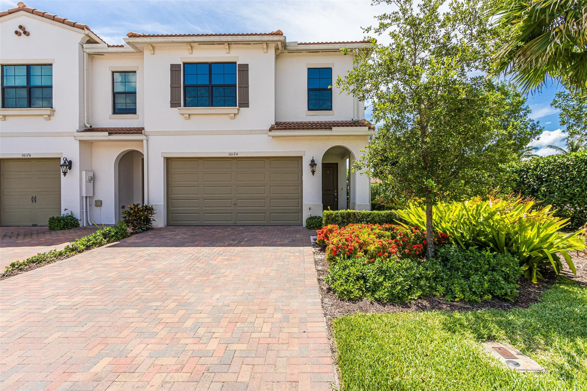 You will LOVE this stunning Lake Front Corner Townhouse. 3 Bedroom + Loft  2+1/2 Baths and 2 Car Garage with epoxy floor and custom cabinetry. Complete with impact doors and windows. Kitchen features gorgeous custom cabinetry, quartz counters and glass back splash. Addl features include stainless steel appliances,double oven, cooking island, oversized pantry and a chef station.  Over 2000 living Sq. ft   Primary Suite features: California built in closets in walk in closet. Bath features a glass enclosed shower, tub and dual sinks.   Laundry room conveniently located upstairs and equipped with front loader washer & dryer. Community well managed featuring large community pool, State of the art fitness center, billiard table, Tot Lot/Play ground. Get in by the new school year. A Schools!