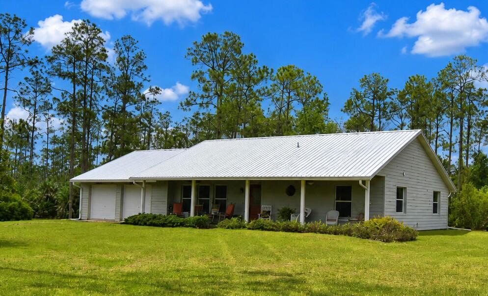Charming 3 BR/3BA/2 Car Garage. CBS Block home on 2.67 acres in private, gated Indian Hammock Hunt and Riding Club located in northern Okeechobee County West of Vero Beach. Perfect for large family gatherings . Sleeps 10 with RV Hookup for electric and water. New metal roof. Home is offered mostly furnished. Low HOA fees.  Community Amenities include Dining Lodge, Fitness center, Tennis/pickelball courts, Heated pool, Fishing, Rifle/Pistol range, Sporting Clays Course, Air Strip and Hangers, Horse Pastures and stables, Private quail, deer and hog​​‌​​​​‌​‌​​​‌‌​​​‌‌‌​​‌​​‌‌​​​​ hunting.