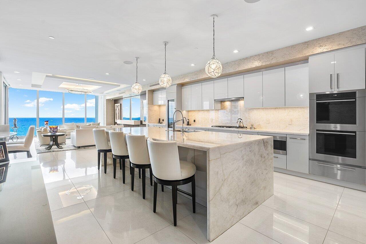 Experience the epitome of luxury living with this stunning residence at 5000 North Ocean. This exceptional home offers a unique blend of elegance and modernity, boasting 3753 living square feet of space and custom-designed finishes. 

From the moment you step into your private elevator foyer, you'll be greeted by custom wood entry doors, architectural floor-to-ceiling windows, and breathtaking views of the Atlantic Ocean, Intracoastal waterways and MacArthur Beach State Park. The open-concept living space is perfect for entertaining, with a smart home integrated system controlling audio, video, and electric shades throughout.

Professionally designed, every detail has been meticulously chosen to create a one-of-a-kind masterpiece. Custom lit closets, hideaway patio screens, and custom furniture designed specifically for the space are just a few of the many features that set this home apart.

5000 North Ocean offers an array of amenities, including a state-of-the-art fitness center, clubroom, and a stunning pool. With 24-hour concierge service and a manned gate, this boutique ultra-luxury building provides the ultimate in security and convenience.

Don't miss this wonderful opportunity to own the most distinctive home in Singer Island's newest luxury building. This is coastal living at its finest.
