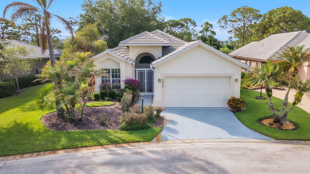 This beautifully maintained 2-bedroom, 2-bath single-story home offers approximately 2,200 sq ft of comfortable living in the highly desirable Marsh Landing at The Reserve within PGA Village. Featuring vaulted ceilings, an open floor plan, and a spacious screened heated pool with serene golf course views, this 1995 Doral model is move-in ready. Enjoy low-maintenance living with HOA-covered lawn care in a gated community that provides full access to the Island Club amenities — including resort-style pools, fitness center, tennis, pickleball, and more. Perfect for year-round Florida living, seasonal escapes, or investment. Professional, polished, and ready for its next owner.