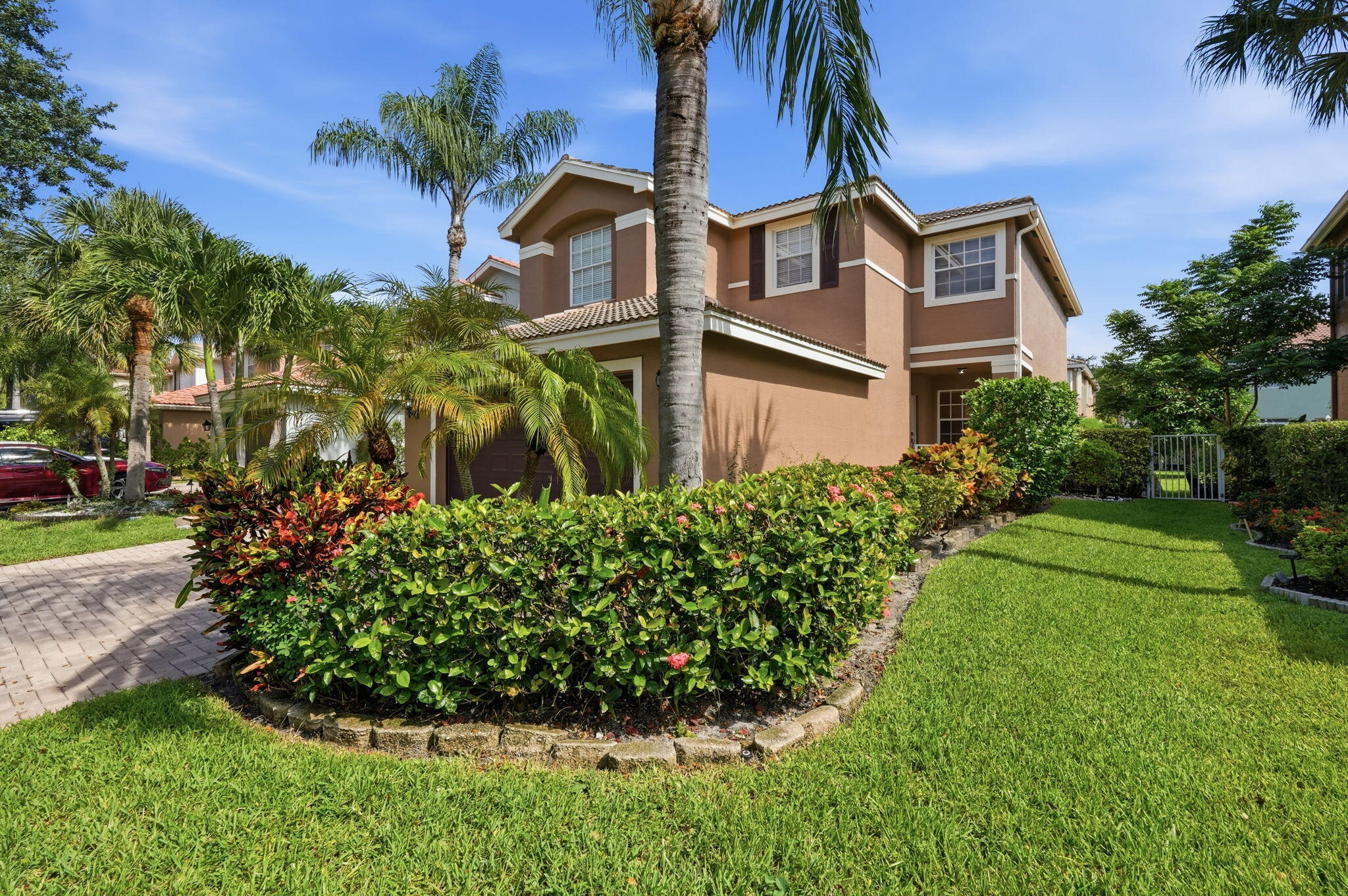 Welcome to this spacious 5-bedroom, 3-bathroom home located in the highly sought-after gated community of Nautica Lakes. Offering over 2,500 square feet of living space, this well-designed floor plan provides the perfect combination of comfort, flexibility, and functionality. The first floor features a full bedroom and bathroom, making it ideal for guests, multi-generational living, or a private home office. Multiple living and dining areas create an inviting atmosphere for both everyday living and entertaining. Energy-efficient solar panels help reduce monthly electric costs, providing long-term savings for the new owner. The attached two-car garage, generous living spaces, and thoughtfully designed layout make this home an exceptional value. Fenced with an outdoor patio. Enjoy all that Nautica Lakes has to offer, including a gated entrance, community amenities, and a convenient location just minutes from shopping, dining, parks, top-rated schools, Wellington, and major commuter routes. Short Sale - Subject to Lender Approval. This is an outstanding opportunity to purchase one of the larger floor plans in a desirable Palm Beach County community at an exceptional value. Don't miss your chance to make this home your own! Some photos have been virtually decluttered and/or virtually staged to illustrate the home's potential. Actual furnishings and contents may differ.