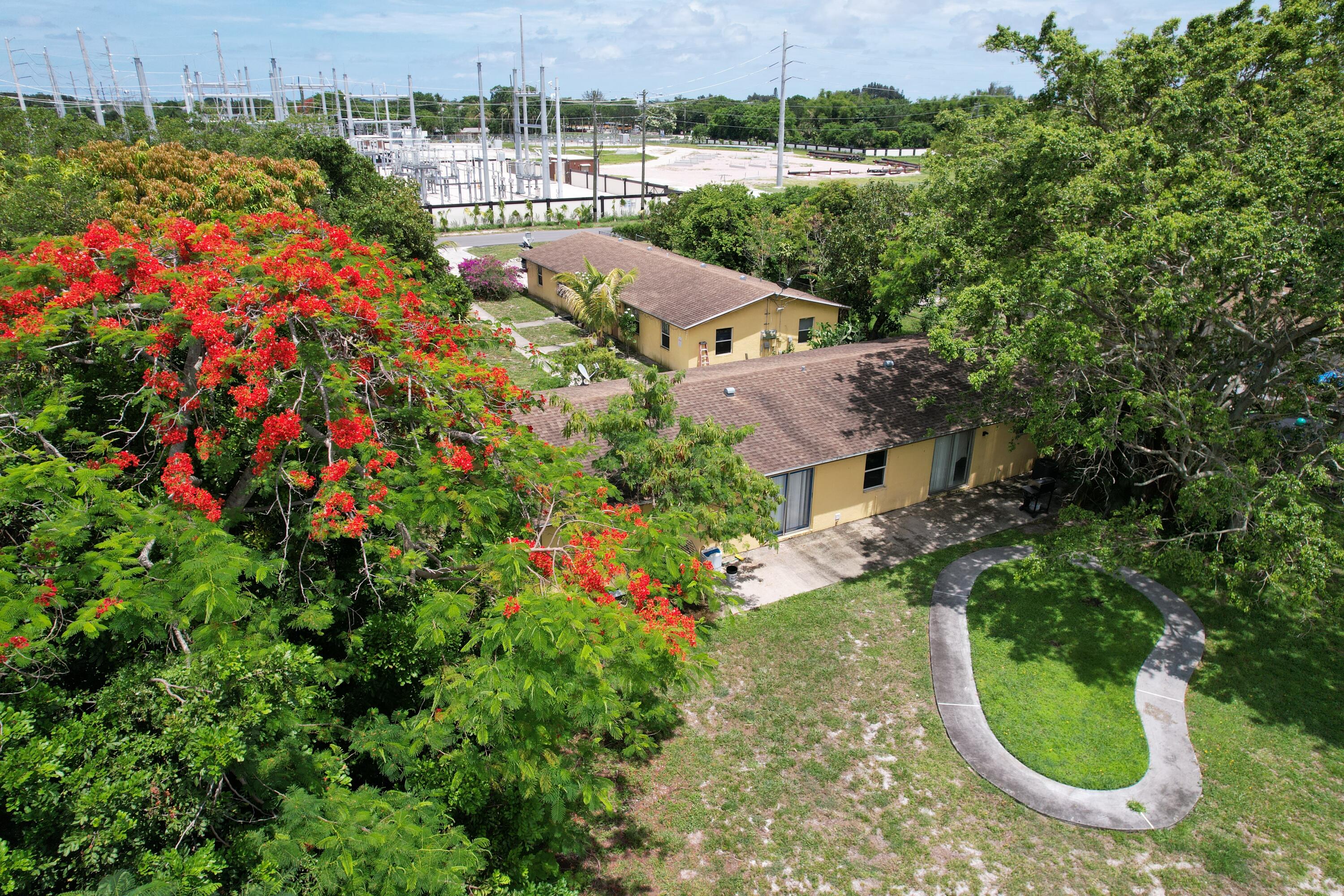 LAND LAND LAND - Exceptional value-add investment opportunity in the heart of Lake Worth! Situated on an oversized nearly 0.80-acre lot, this income-producing property offers tremendous upside potential for investors, developers, and portfolio builders alike. Professionally managed and positioned on one of the area's largest residential parcels, the property provides ample room for future expansion, additional units, or redevelopment opportunities—potentially allowing occupancy to be doubled.  All units have an additional "spare or flex" room good for an office or for a kid's room!  A unique feature of the property is the existing buried swimming pool, which may be restored and brought back to life, creating additional value and tenant appeal. Adding to the property's long-term desirability, there are currently no future development plans for the lots directly north of the property, helping preserve privacy and open space.  Conveniently located near I-95, Palm Beach International Airport, downtown Lake Worth Beach, and major employment centers, this property offers strong rental demand and excellent accessibility. Residents enjoy proximity to beautiful beaches, John Prince Park, golf courses, boating, shopping, dining, and entertainment. Just minutes away, downtown Lake Worth Beach features vibrant restaurants, art galleries, live music venues, breweries, and year-round community events. The nearby Lake Worth Beach Municipal Golf Course, waterfront parks, fishing piers, and Atlantic Ocean beaches provide endless outdoor recreation opportunities.  Whether you're seeking immediate cash flow, future redevelopment potential, or a long-term hold in a rapidly growing Palm Beach County market, this property presents a rare opportunity with significant upside.