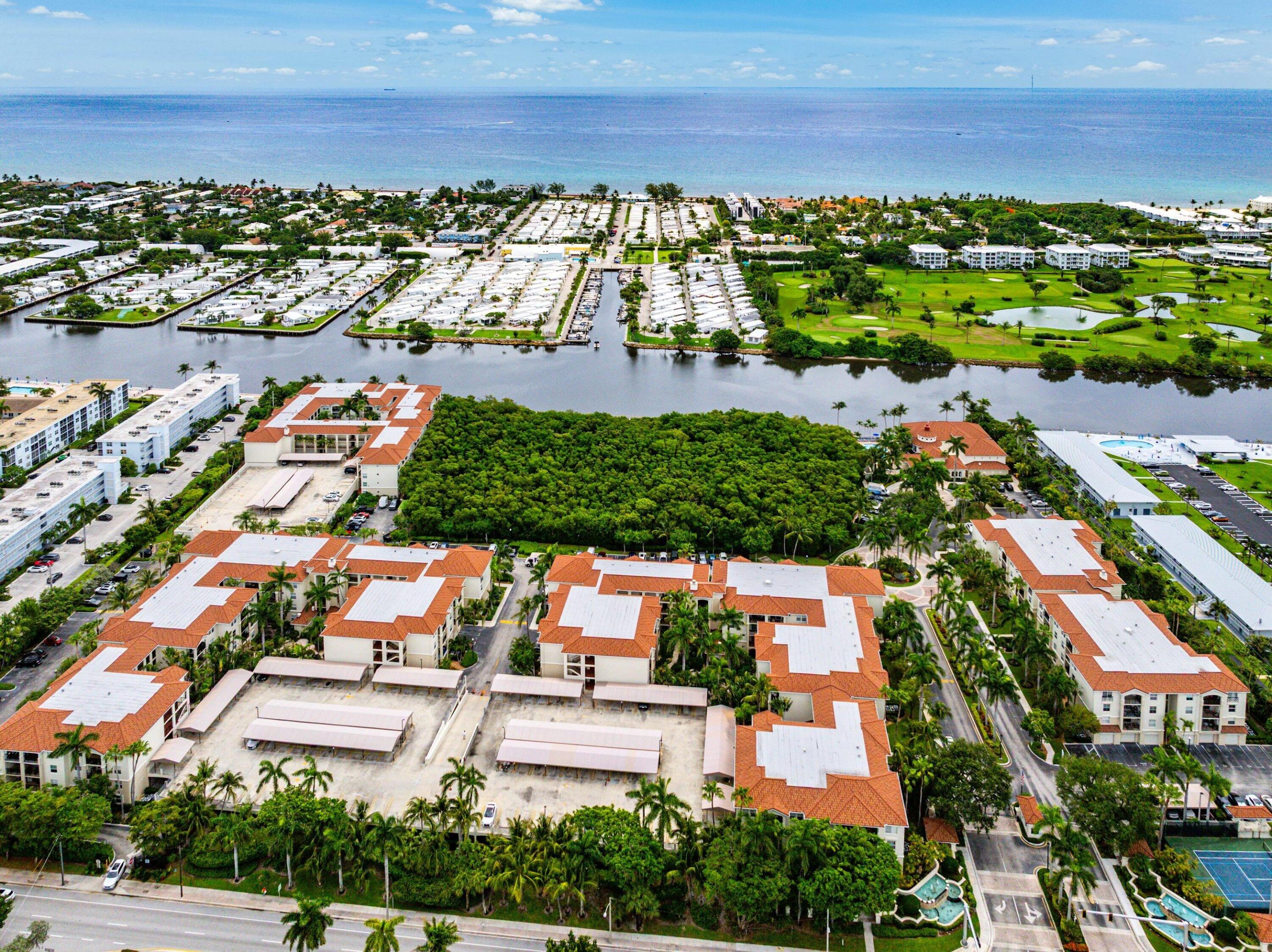 Welcome to 1210 Tuscany Way, a beautifully renovated 2-bedroom, 2-bath residence in the highly sought-after Tuscany on the Intracoastal, one of East Boynton Beach's premier waterfront communities. Offering the perfect blend of luxury, comfort, and resort-style living, this move-in-ready condo is ideal as a primary residence, seasonal retreat, or investment property. This desirable split-bedroom floor plan features two spacious primary suites, each with walk-in closets and beautifully updated bathrooms, providing comfort and privacy for residents and guests alike. The interior showcases high-end waterproof engineered hardwood flooring, crown molding, impact windows, plantation shutters, recessed lighting, custom fixtures, and designer finishes throughout.  The open-concept kitchen serves as the heart of the home and features quartz waterfall countertops, a peninsula island, stainless steel Whirlpool appliances, white cabinetry, designer tile backsplash, and ample space for entertaining. The kitchen flows seamlessly into the dining and living areas, highlighted by a cozy fireplace and access to a private balcony overlooking peaceful, landscaped grounds. The primary suite offers a spa-inspired bathroom with dual marble vanities, marble flooring, and a large walk-in shower. The second primary suite features an oversized tub/shower combination, quartz vanity, and generous closet space, creating the perfect guest retreat. Residents of Tuscany on the Intracoastal enjoy an exceptional waterfront lifestyle with a private Intracoastal boardwalk, resort-style swimming pool and spa, renovated clubhouse, fitness center, tennis court, pickleball courts, basketball court, game room, grilling areas, and beautifully maintained grounds. This gated community is conveniently located just minutes from Boynton Beach's pristine beaches, waterfront dining, shopping, entertainment, marinas, and major highways, while also offering easy access to the vibrant restaurants, boutiques, and nightlife of nearby Delray Beach. Experience the best of South Florida living in this fully renovated waterfront community residence where luxury finishes, modern upgrades, and outstanding amenities come together in one exceptional location.