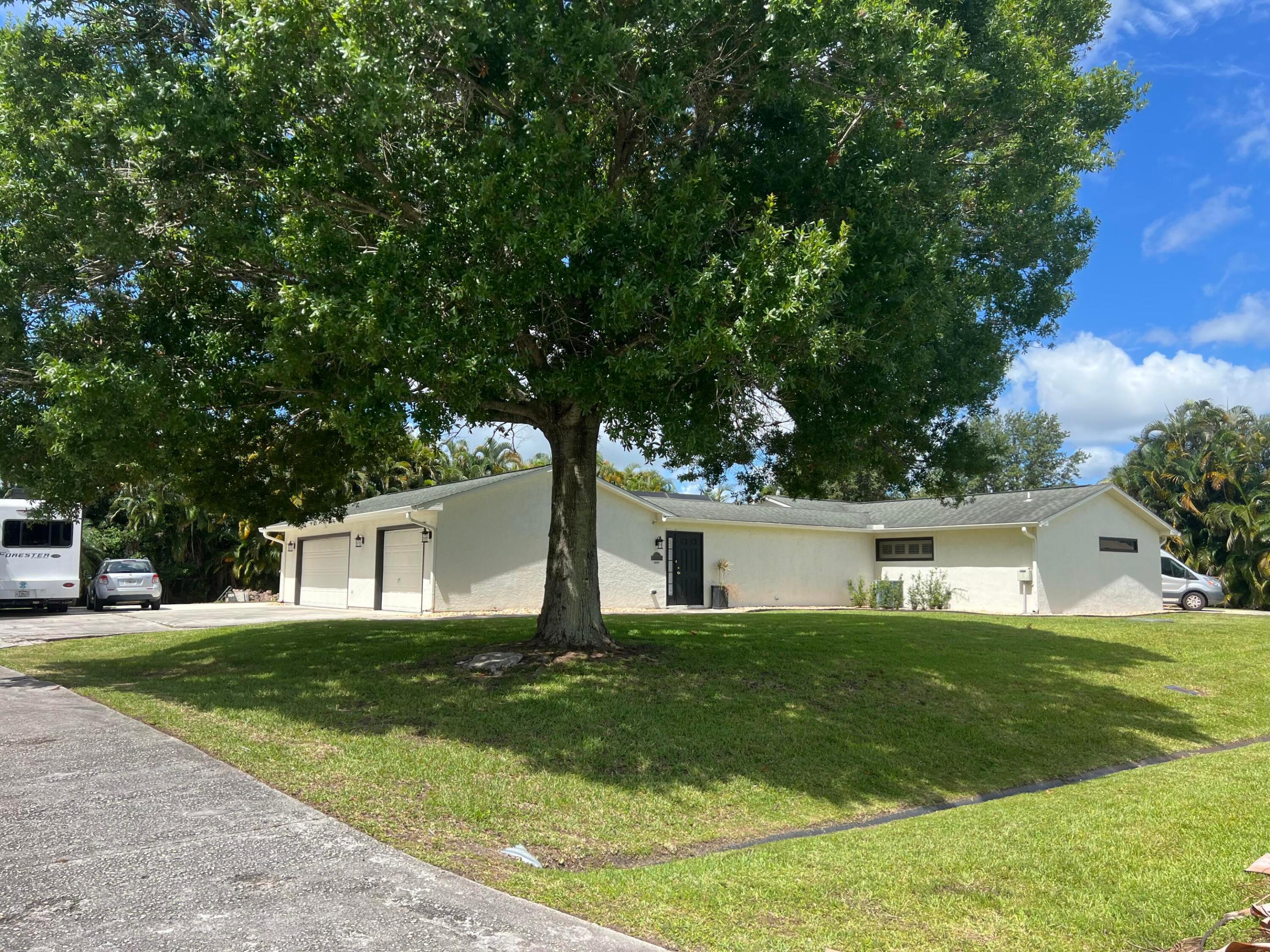 Come discover this single-family POOL HOME on almost HALF AN ACRE in Port St Lucie! HUGE DOUBLE LOT! No HOA or CDD fees! 2 MASTER BEDROOMS! Updates include a newer kitchen with gas range, 3 updated bathrooms and brand new plantation shutters throughout. Neutral tile also throughout, no carpet! This home also features double driveways with plenty of room for multiple boats, RV's and other hobbies. An expansive 3 car garage with a new AC system for your model cars or additional living space! Enjoy year-round peace of mind with a whole-house Generac Whisper Quiet 48kw Generator with all new wiring in 2024! AC 2021, Garage AC 2024, Roof 2004, WH 2022, Pool System 2025.