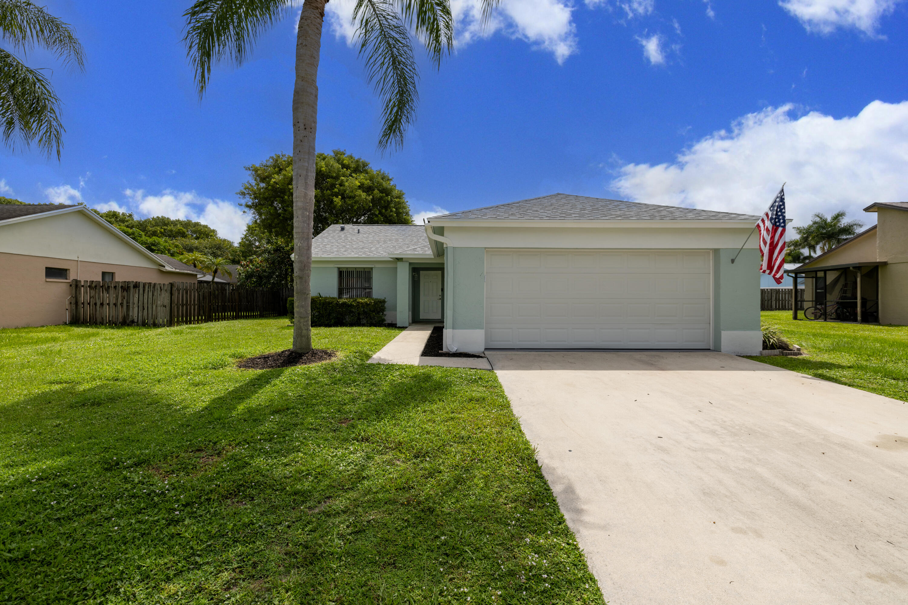 Welcome home to this beautifully updated single-family residence in Counterpoint Estates, offering a bright and inviting space that feels like home the moment you arrive. Located in Royal Palm Beach, the three-bedroom, two-bathroom residence features a bright living space enhanced by soaring vaulted ceilings and a cozy fireplace. The thoughtful 1,232 square foot layout showcases a completely renovated kitchen, beautifully refreshed bathrooms, and new flooring throughout. Enjoy peace of mind with significant updates, including a brand-new roof and water heater installed in 2026, alongside a newer air conditioner. Outside, the property includes a two-car garage and a fully fenced backyard perfect for outdoor gatherings and relaxation.   This property combines modern updates with everyday comfort in a welcoming neighborhood setting. All measurements are approximate. Take a look at the 3D virtual walkthrough today.