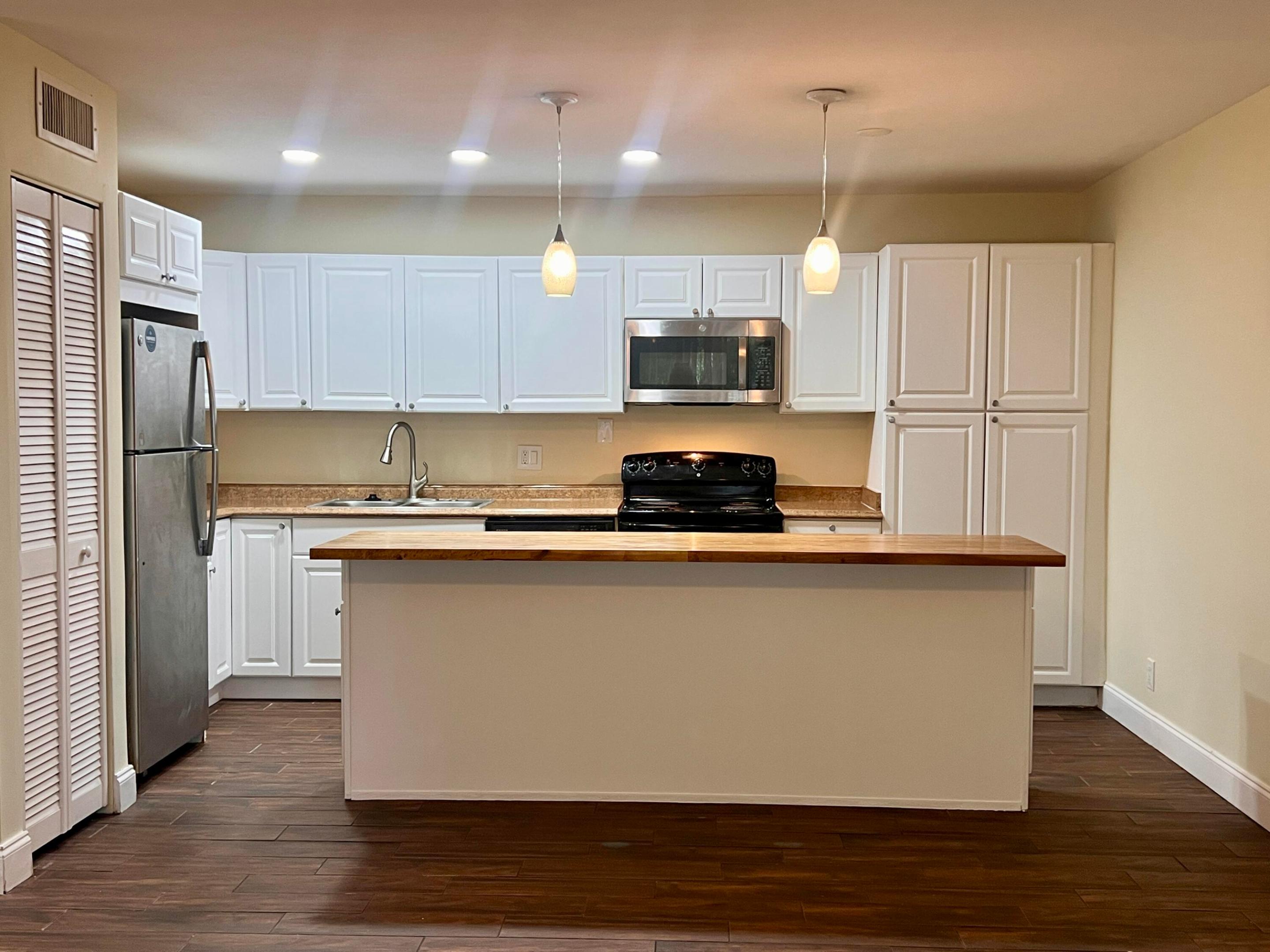 A MUST SEE! Spacious and bright 2 bedroom, 1 bathroom condo with open-concept layout, tile floors throughout, and a kitchen island with seating.  Two well equipped  laundry rooms, Fast HOA approval. No pets allowed per Association. Cross Creek Condo is a well-maintained community in a great location near Palm Beach Outlets, Whole Foods, I-95, and just minutes from CityPlace, Downtown West Palm Beach, and Palm Beach International Airport.