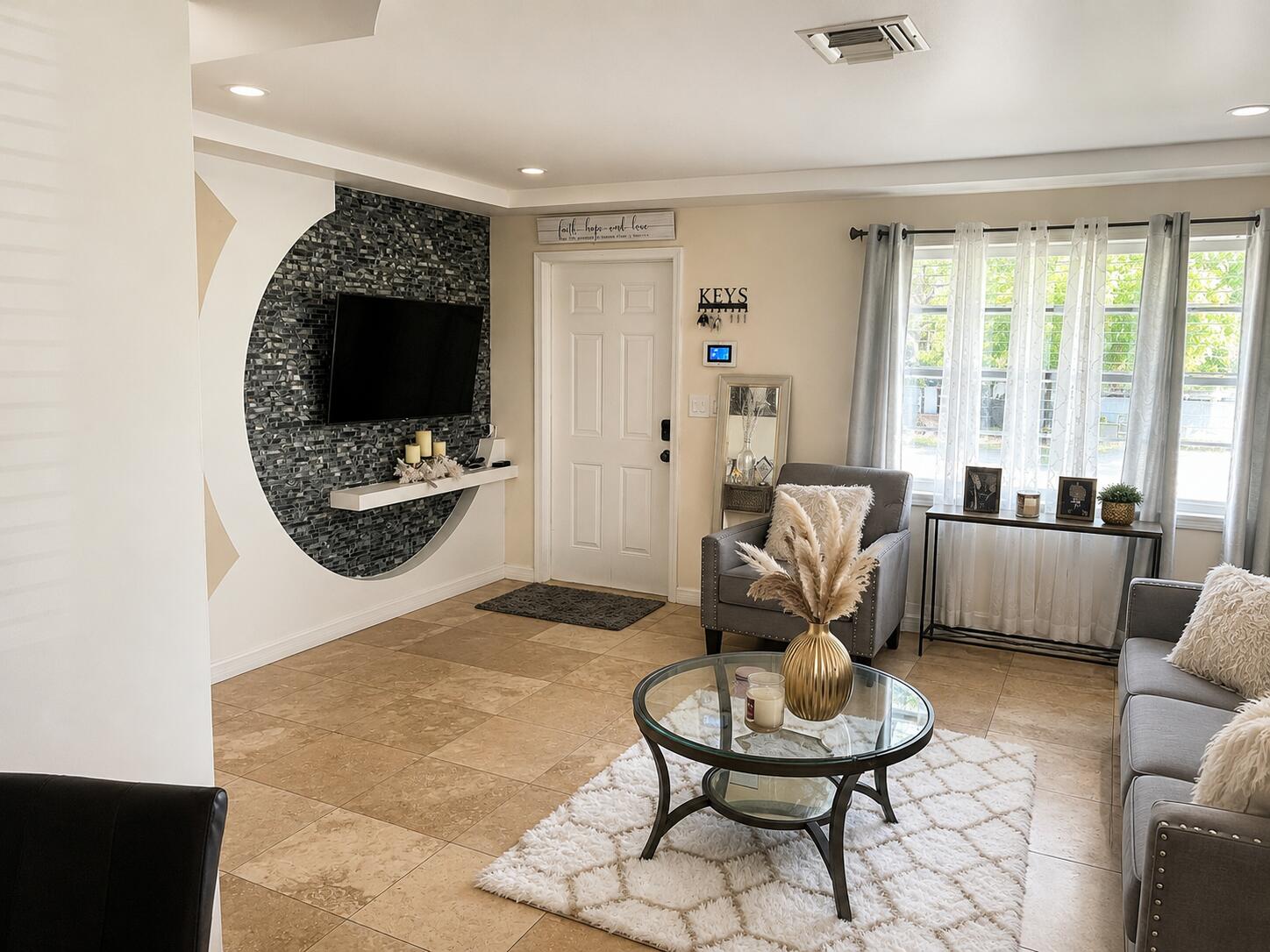 Discover one of the best values in Riviera Beach! This beautifully updated 4-bedroom, 2-bathroom CBS home is located on W. 1st Street, a desirable area where many of the surrounding homes are owner-occupied, creating a strong sense of pride in ownership.  This home has been  renovated with Elegant travertine tile flooring throughout the entire home, including the bathroom walls. Floors and walls professionally sealed for added durability and protection. Fresh interior and exterior paint. A stunning new kitchen with granite countertops and stainless steel appliances.  modern bathroom vanities.  gas water heater. Solid CBS construction.
