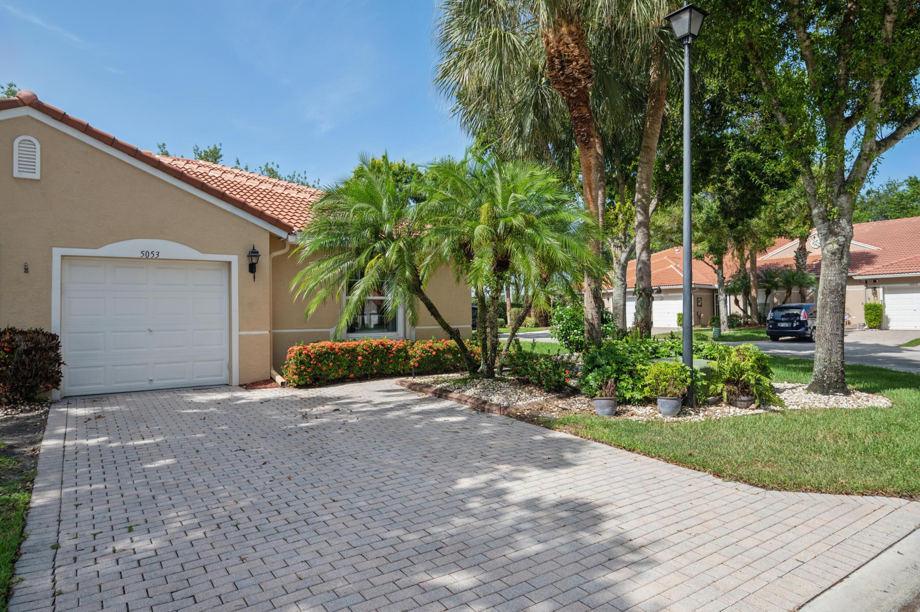 This Majestic corner villa is a true 3 bedroom with 2 bathrooms and is Exceptionally Amazing! Here are a few of the features, a brand new roof, full house generator, new double pane windows and a glass sliding door, crown molding, remodeled kitchen with white cabinets, Quartzite counters and stainless steel appliances. It is diagonally tiled throughout the living areas with carpet in the primary bedroom and laminate flooring in the guest bedroom. There's an extended screened and tiled patio looking out to a green space. The association has so many social activities to enjoy its like being at an adult camp! There's dinners, dances, shows, art classes, exercise classes, BBQ's plus more. The recreational area has 6 Tennis courts, 3 pickleball courts, bocce and a putting green.  The association requires 6 months maintenance paid at closing for capital investment plus a 680 credit score.