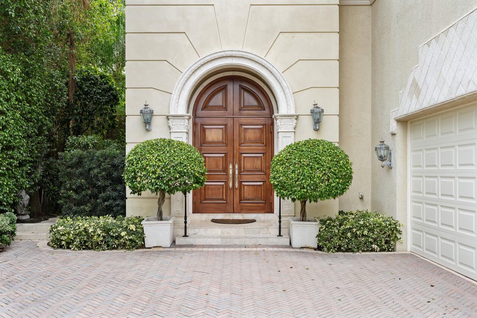 Dramatic double mahogany doors open into this exquisite 3,660-sq.-ft., classic Palm Beach-style townhouse on an oversized lot, with soaring 14-ft. ceilings, five bedrooms, five-and-a-half baths and a lushly landscaped private pool. This renowned Euro Homes-built residence completed in 1998 features an elevator, marble floors, crown moldings, and custom windows on both levels. This rarely-available property on one of the most coveted streets on Palm Beach Island is down the street from The Breakers and Royal Poinciana Way, and one block from the beach. As the adjoining townhome is also for sale, there is a once-in-a-lifetime opportunity to combine the two, for the first time in history, into a magnificent 7,000-plus-sq.-ft. mansion with a four-car garage, for an unrivaled in-town residence. Those fortunate enough to pass through the arched mahogany doors will find an entry boasting a beautiful foyer with a graceful marble staircase lined with wrought-iron and wooden railings leading up to the second level, which can also be accessed by the private elevator. Upstairs there is a spacious master suite with dual bathrooms, as well as dual walk-in closets, in addition to three other bedrooms. A spacious gourmet chef's kitchen with beautifully-made custom cabinetry is adjacent to a breakfast nook/casual dining area. In addition there is a proper formal dining room and a living room featuring an opulent cast-stone fireplace. The living room has sliding doors leading out to an inviting pool area with an outdoor kitchen, which is perfectly situated due to its highly desirable southern exposure. The two-car garage has been equipped with an entire wall of custom cabinetry for additional storage. This garage was most recently used as a second home office, but can easily be utilized for two vehicles or as the perfect space for a private home gym/fitness center.

The property has had only one owner, who originally commissioned it 23 years ago and maintained it in meticulous condition, while updating systems and appliances and similar items as necessary. The elegant layout, classical elements and architectural details, spacious rooms and lofty ceiling height all speak to Palm Beach's position as America's premier resort community for affluent society, tastemakers, and the international jet set. The central air conditioning assures constant comfort. It is the perfect pied-à-terre for those interested in partaking in all that the area has to offer, from yachting to polo, championship golf, and unparalleled luxury retail and hospitality, all located within a short distance from the property. Also nearby are Bradley Park, the bicycle trail, the acclaimed Meat Market steakhouse, Temple Emanu-El, and the Palm Beach Yacht Club directly across Flagler Memorial Bridge.  

The neighborhood is one of the most prestigious in Palm Beach, and certainly the most desirable for those seeking the unparalleled convenience of an in-town residence. Among the most important places that are a mere few blocks' walk from the front door are Greene's Pharmacy, a c.1938 luncheonette and gathering place for Palm Beach's most prominent residents; The Royal Ponciana Plaza, an incomparably luxury retail destination where "style, energy and spirit collide," designed for "indulgence, inspiration and retreat," where one can buy everything from a loaf of freshly-baked rye bread to an Hèrmes Birkin bag; and the famed Biltmore and Breakers hotels, icons of Palm Beach style and elegancethe latter offering membership at The Breakers Ocean Club, where you can choose to avail yourself of the pools, spa, beach club, tennis courts and 36 holes of championship golf, as well as some of the best restaurants in the Southeastern United States and the gorgeous HMF bar / lounge. 

Regarding the unprecedented opportunity to combine 242 and 246 Everglade Avenue, also designed in the Mediterranean Revival style, into one truly unparalleled residence, the complementary architecture and current layout offer the ability to create a very desirable and spacious estate without having to completely redesign the entire structure. The seller has two proposed blueprints that show how this concept could be executed and its maximum potential realized. The combined residence would have nine bedrooms and ten-and-a-half bathrooms with two private elevators and a four-car garage, on over 1/4-acre of the most sought-after Palm Beach real estate. The existing driveways could be redesigned into a single circular driveway, while substantial privacy hedges could be installed along the front of the property, as well as a grand gated entry, setting it apart from neighboring residences. There are many other options which could allow you to finally design your dream home directly in the heart of Palm Beach by combining the two properties, which has never been done before in the history of the town. 

Both townhomes, which are housed in a standalone structure, were constructed by Euro Homes. For over 30 years Euro Homes has been recognized as Palm Beach's premier custom home builders, and 242-246 Everglade Avenue is one of the best examples of their Old World, artisan craftsmanship and attention to detail. Euro Homes only builds estate homes in the town of Palm Beach and thus retains an exclusivity matched only by its reputation for excellence. Founder and President Zack Ciomek "takes great pride in the knowledge that every project's plan remains true to the heritage of Palm Beach architecture by delivering and creating homes of unparalleled excellence in design and construction techniques," as the company puts it. 

Please contact Samantha Curry at Douglas Elliman directly for more details.