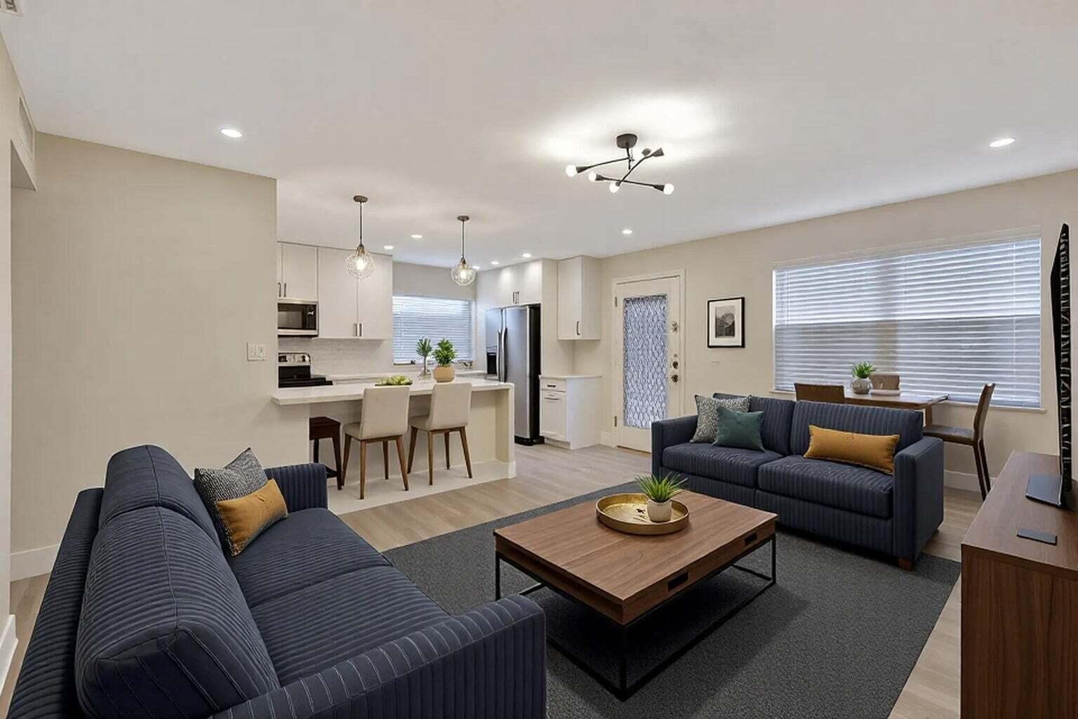 Experience elevated resort-style living at 802 Burgundy Q, a beautifully renovated second-floor residence in the sought-after 55+ Kings Point Golf & Country Club community. Just steps from the Burgundy Satellite Pool, this move-in-ready designer condo showcases tranquil garden views, abundant natural light, and a spacious open-concept layout enhanced by waterproof laminate flooring, fresh neutral paint, recessed lighting, and contemporary fixtures throughout. The stunning chef's kitchen is the heart of the home, featuring elegant quartz countertops with a dramatic waterfall edge, crisp white shaker cabinetry, premium stainless steel appliances, and additional storage, creating the perfect space for both everyday living and entertaining. Both bathrooms have been thoughtfully updated with  designer tile, modern vanities, and stylish fixtures, while the spacious primary suite offers a large walk-in closet and a spa-inspired bath with a beautifully tiled glass-enclosed shower. Enjoy year-round relaxation in the expansive enclosed patio overlooking lush gardens, complete with a convenient utility closet housing a full-size washer and dryer. Residents of Kings Point Golf & Country Club enjoy an exceptional resort lifestyle with championship golf, tennis, multiple pools, fitness centers, clubhouses, dining, entertainment, and an endless calendar of social activities. Combining timeless style, quality craftsmanship, and outstanding community amenities, this meticulously updated home offers a rare opportunity to enjoy effortless South Florida living at its finest. Schedule your private showing today.