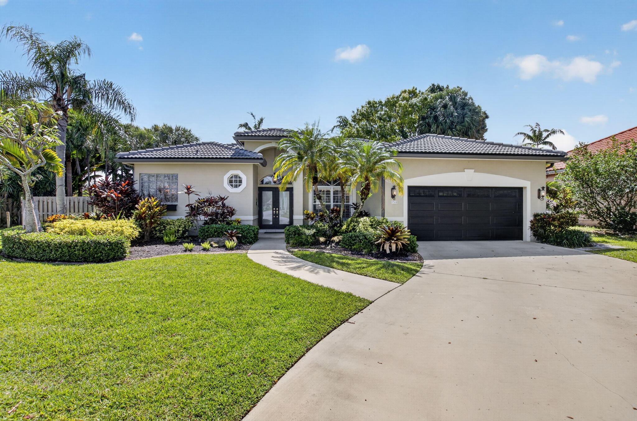 Welcome to your private estate in the highly sought-after Barwick Ranch community, where luxury, space, and location come together on an expansive homesite in the heart of Delray Beach. Featuring a barrel tile roof installed in 2023, a new hurricane-rated front door installed in 2026, and accordion shutters on all windows for complete storm protection, this exceptional residence offers peace of mind while delivering the space, comfort, and lifestyle you've been searching for.  The oversized lot provides a rare opportunity to enjoy privacy. Barwick Ranch offers the best of both worlds—peaceful country-style living with close proximity to vibrant Atlantic Avenue, pristine beaches, top-rated schools, world-class dining, shopping, and major transportation corridors.  The Yard features mature landscaping, and a peaceful setting that feels worlds away while remaining conveniently close to everything South Florida has to offer.
